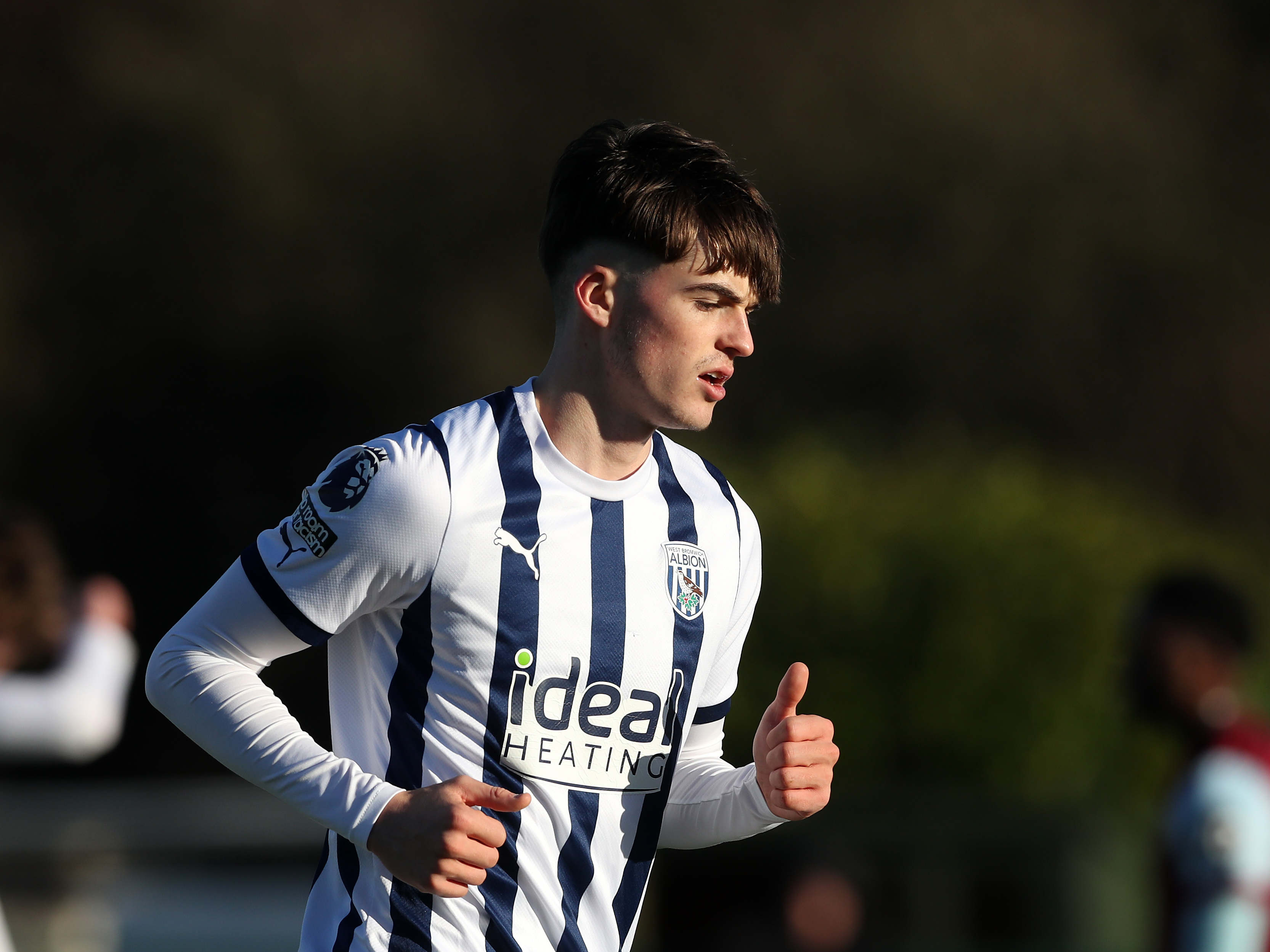 A photo of Albion U21s defender Alex Williams in the 2023/24 home kit