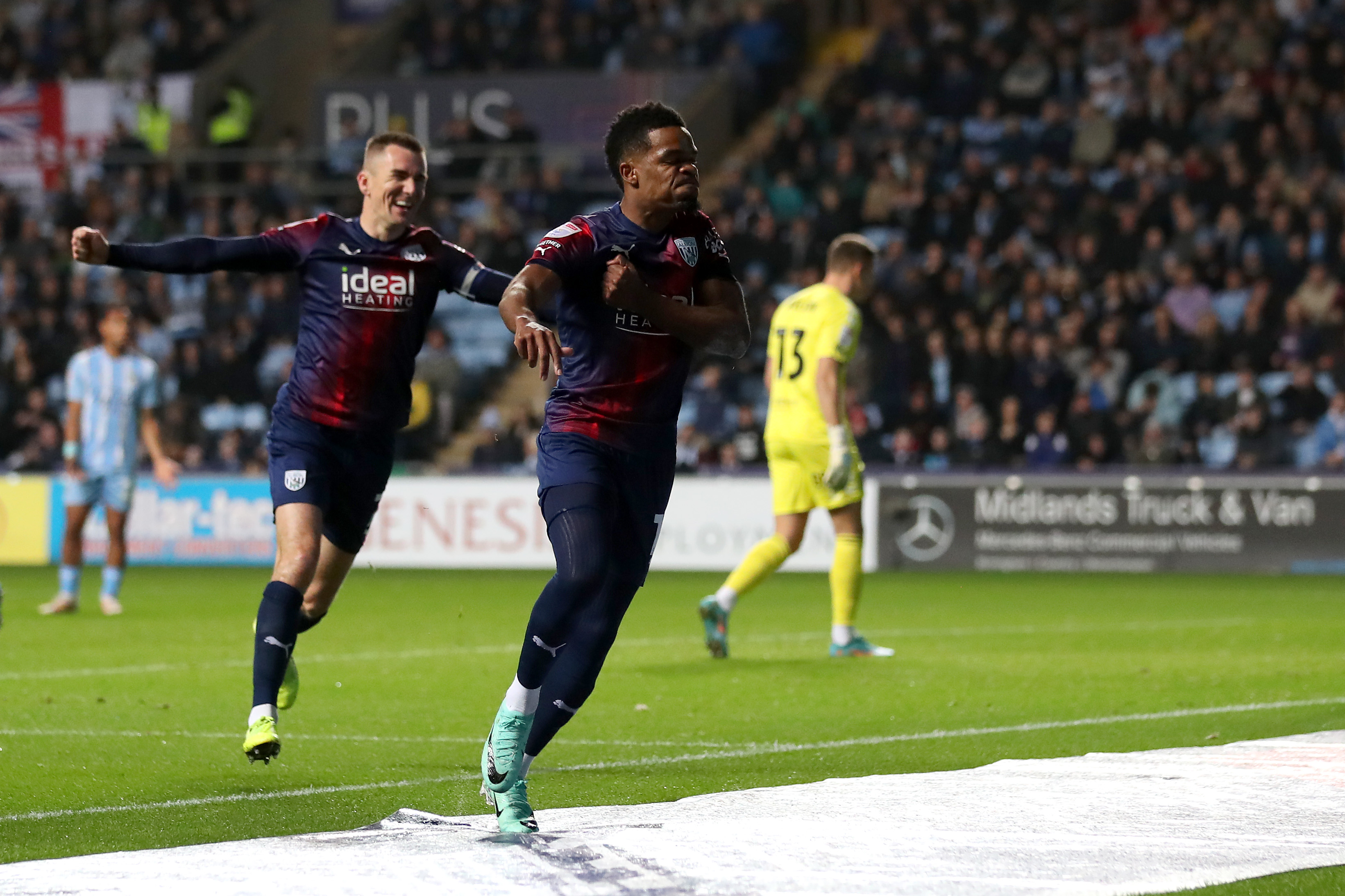Grady Diangana celebrates scoring against Coventry City at the CBS Arena with Jed Wallace closely behind him