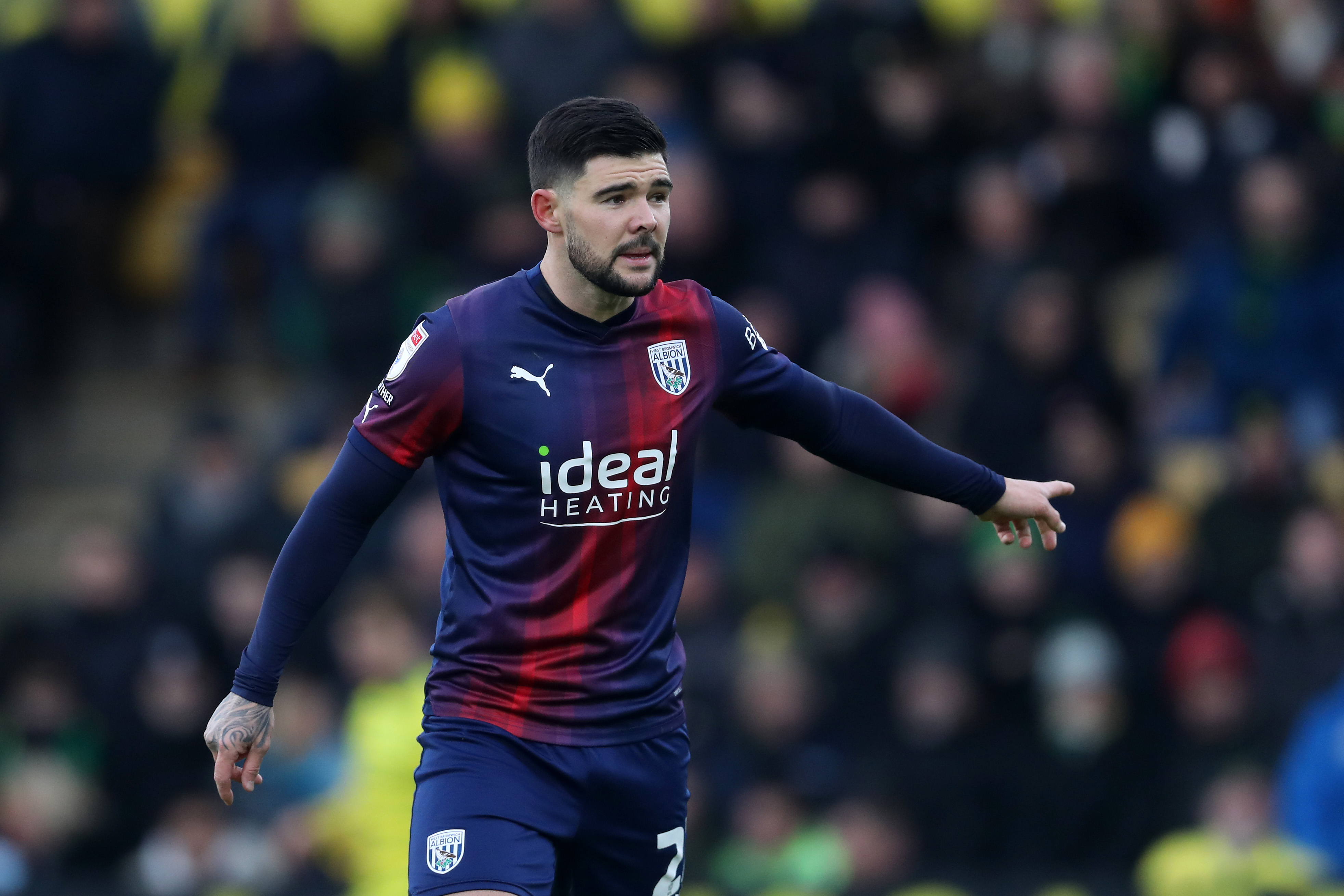 Alex Mowatt wearing Albion's navy-blue-and-red away kit at Norwich City