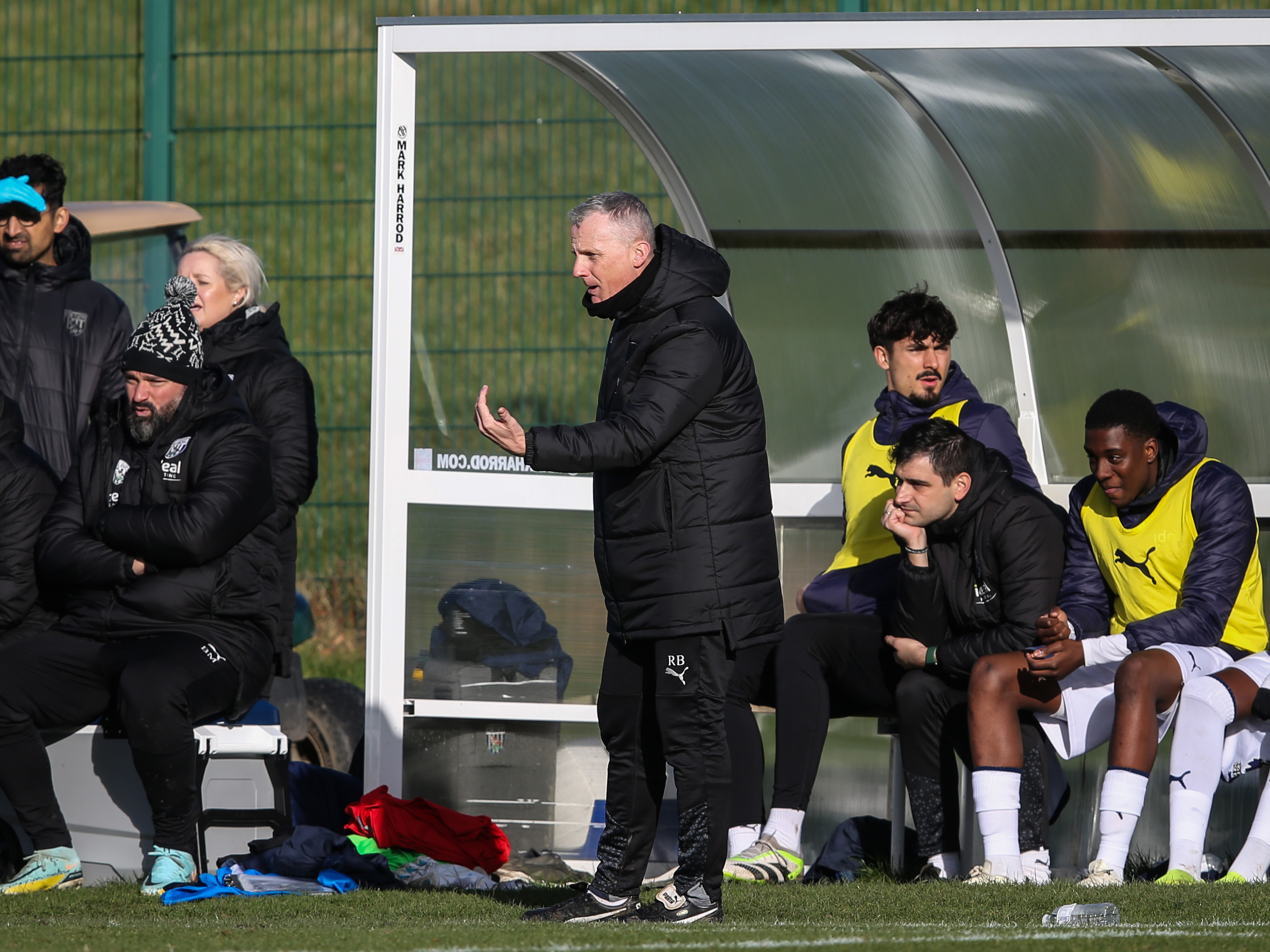 A photo of U21s boss Richard Beale giving instructions from the dugout