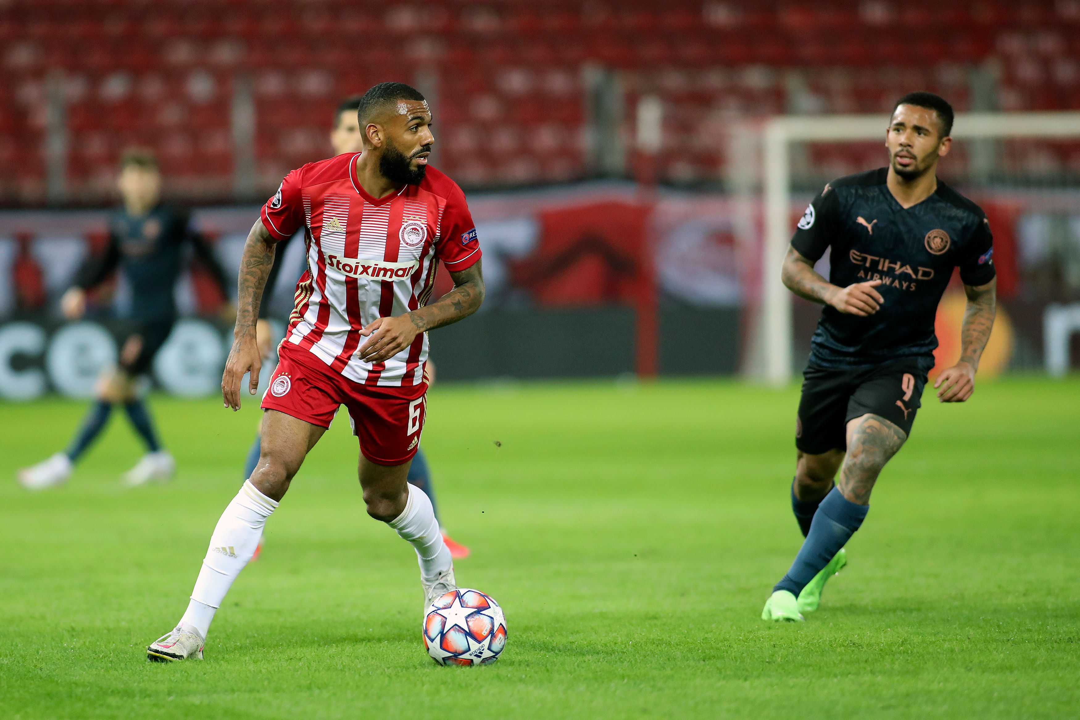 Yann M'Vila in Champions League action for Olympiacos against Manchester City