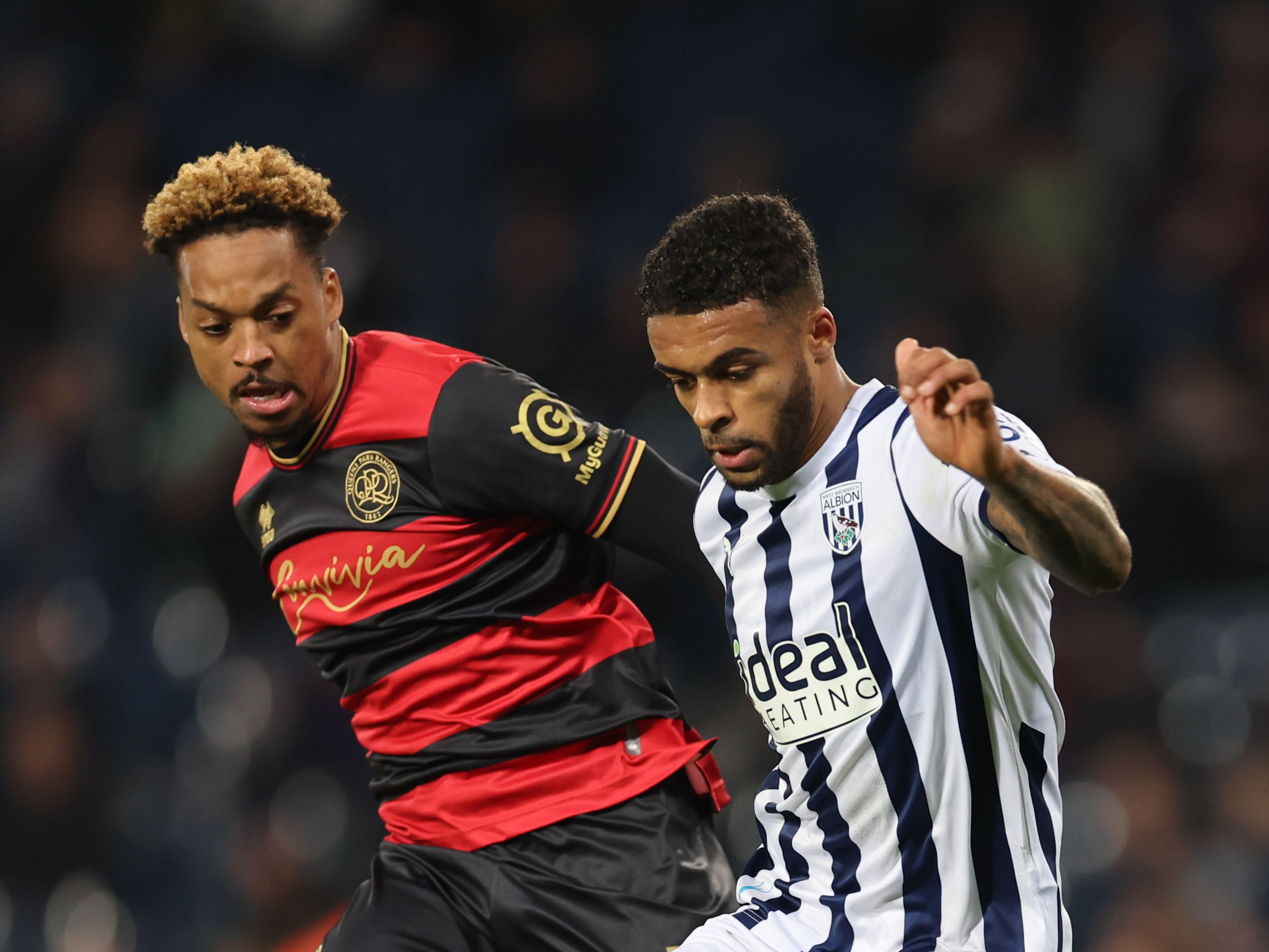 Darnell Furlong fights off QPR's Chris Willock at The Hawthorns