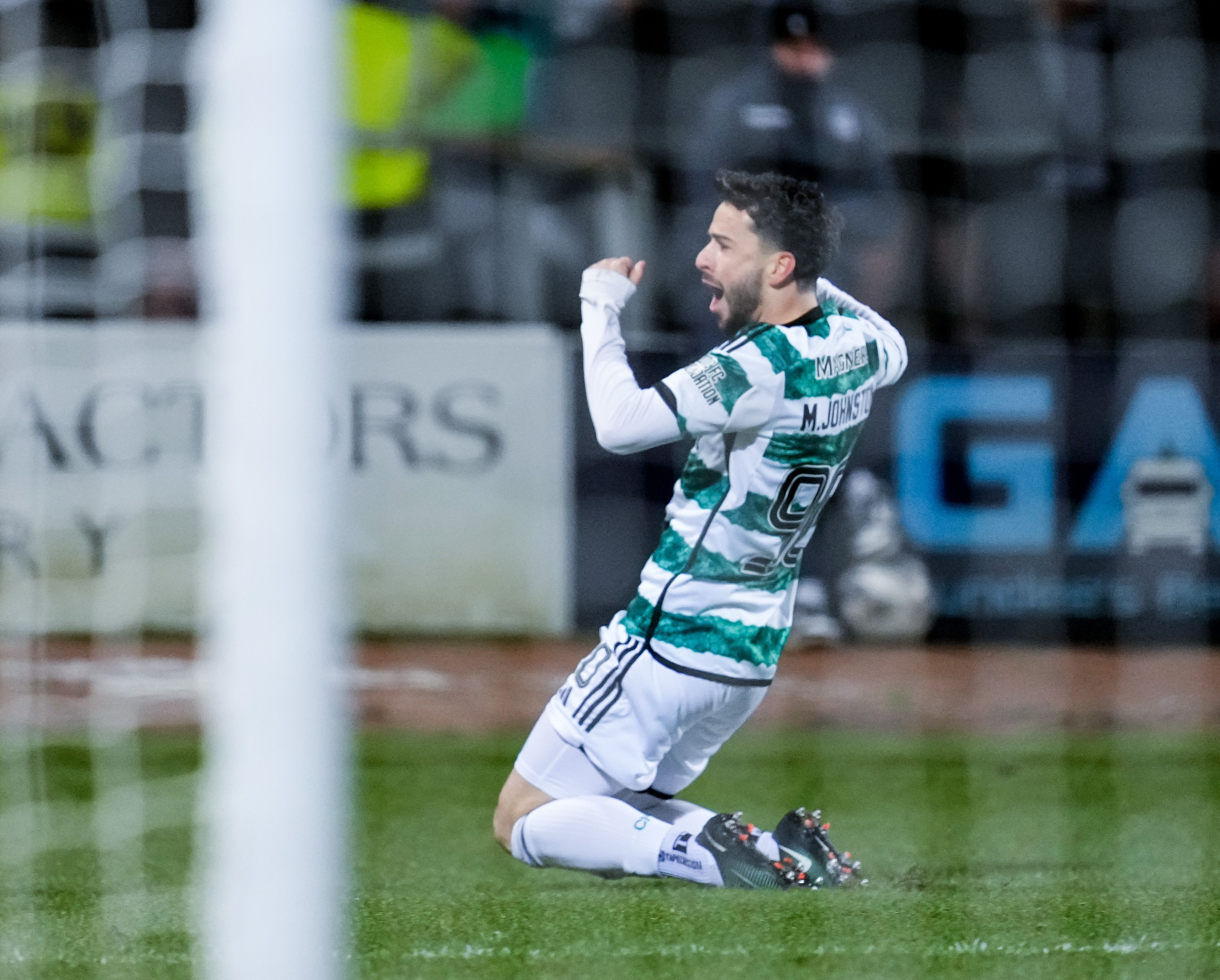 Mikey Johnston celebrates scoring a goal for Celtic at Dundee