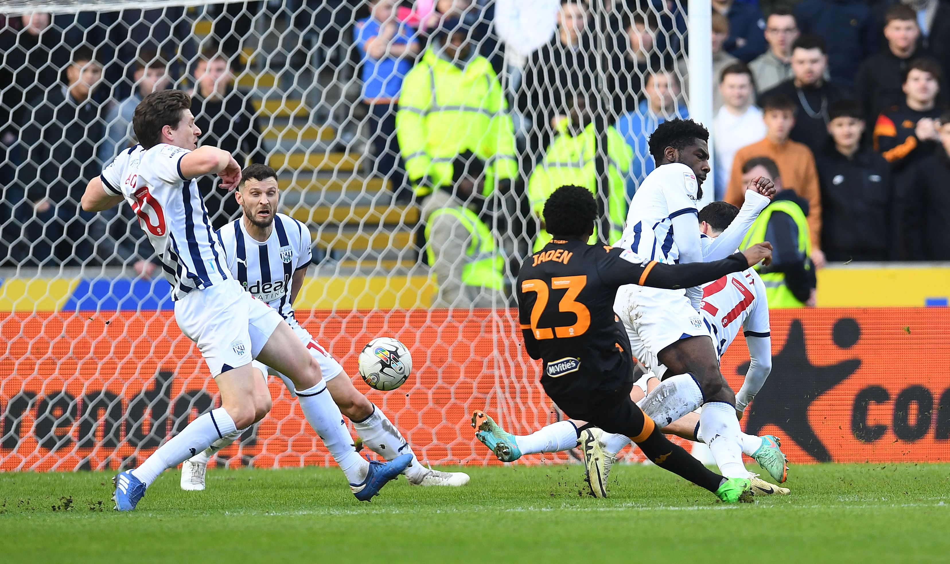 Albion players throw their bodies at the ball to try and block a Hull shot