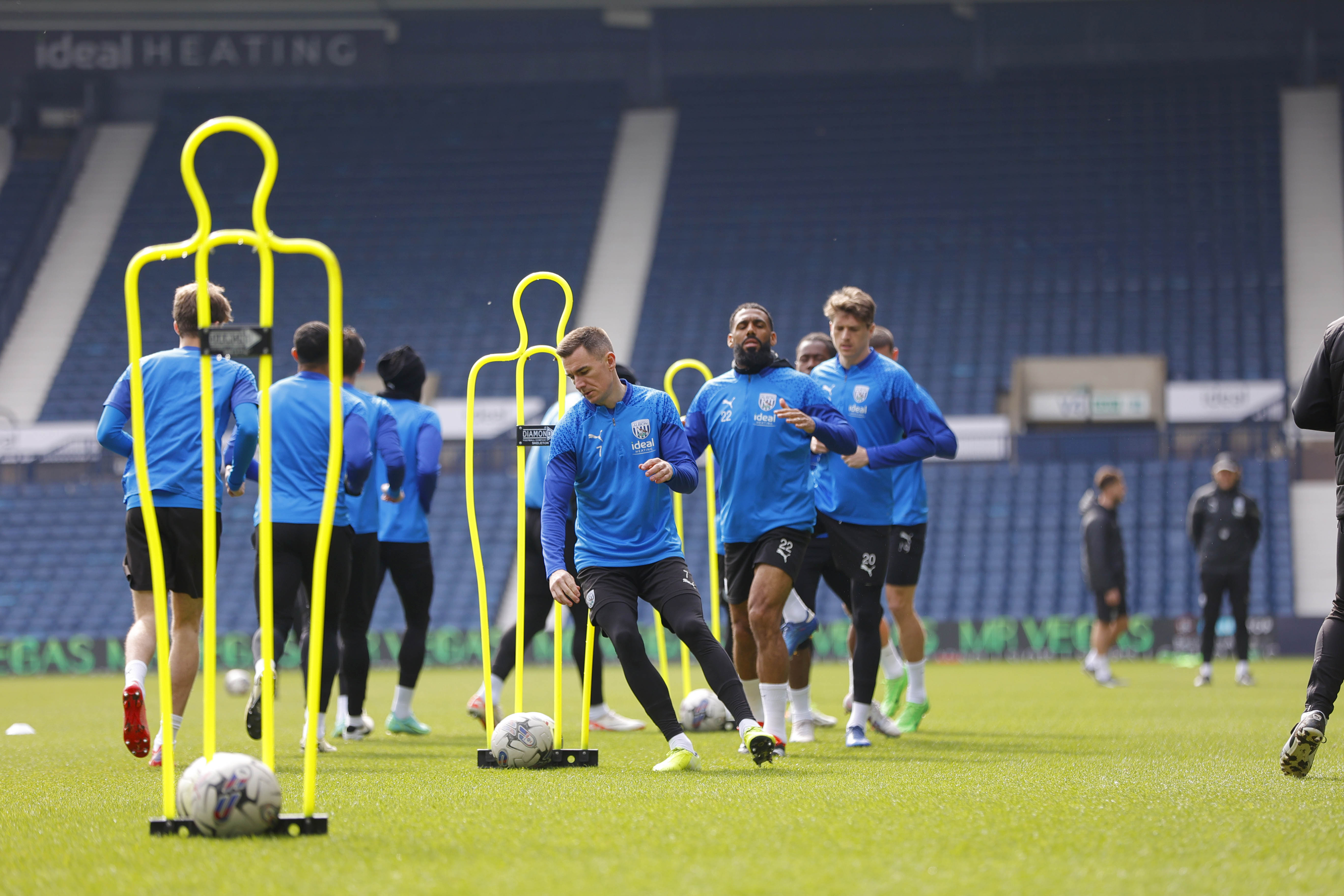 Albion players warming up on the pitch at The Hawthorns during a training session