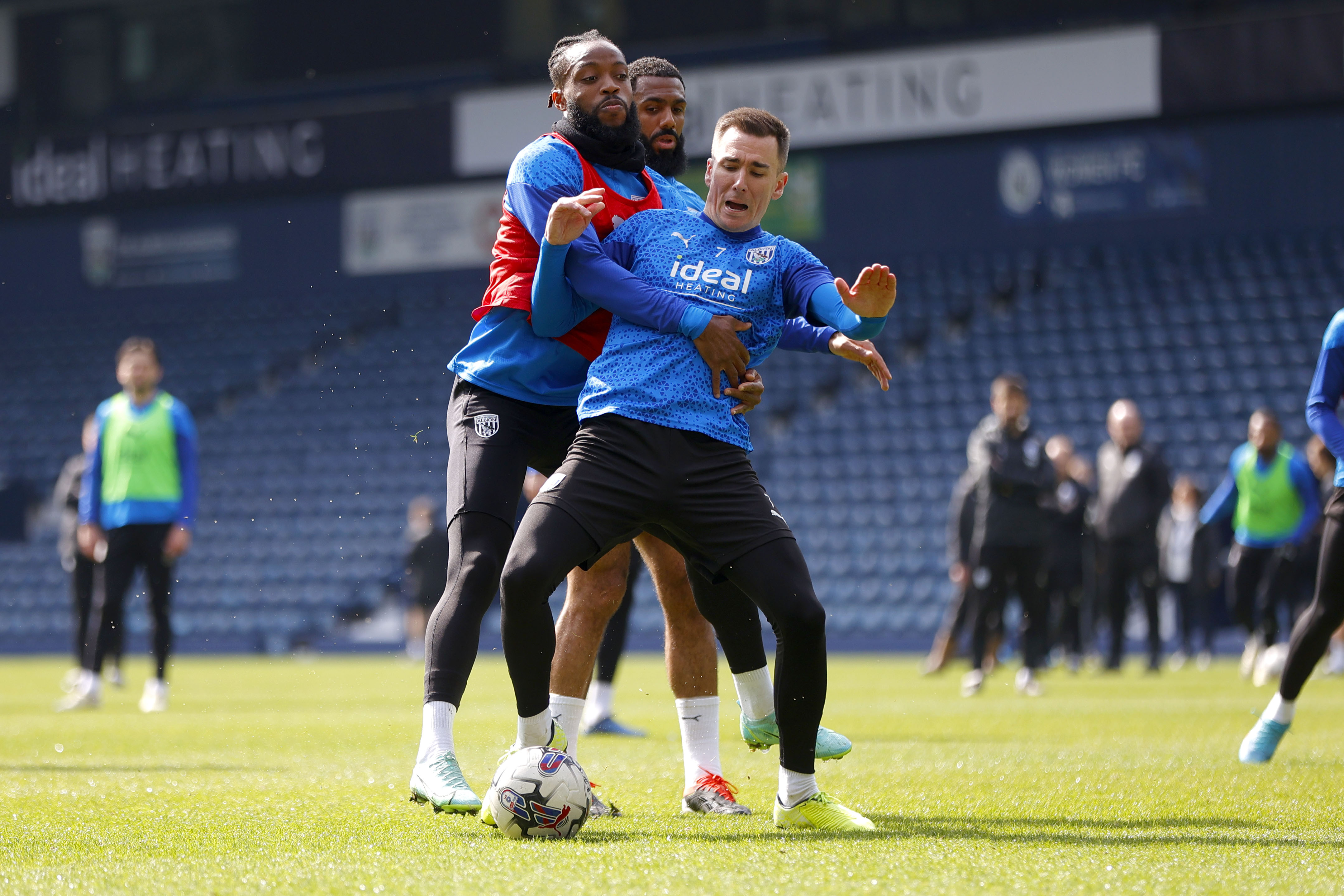 Nathaniel Chalobah and Jed Wallace fight for the ball during a training session at The Hawthorns