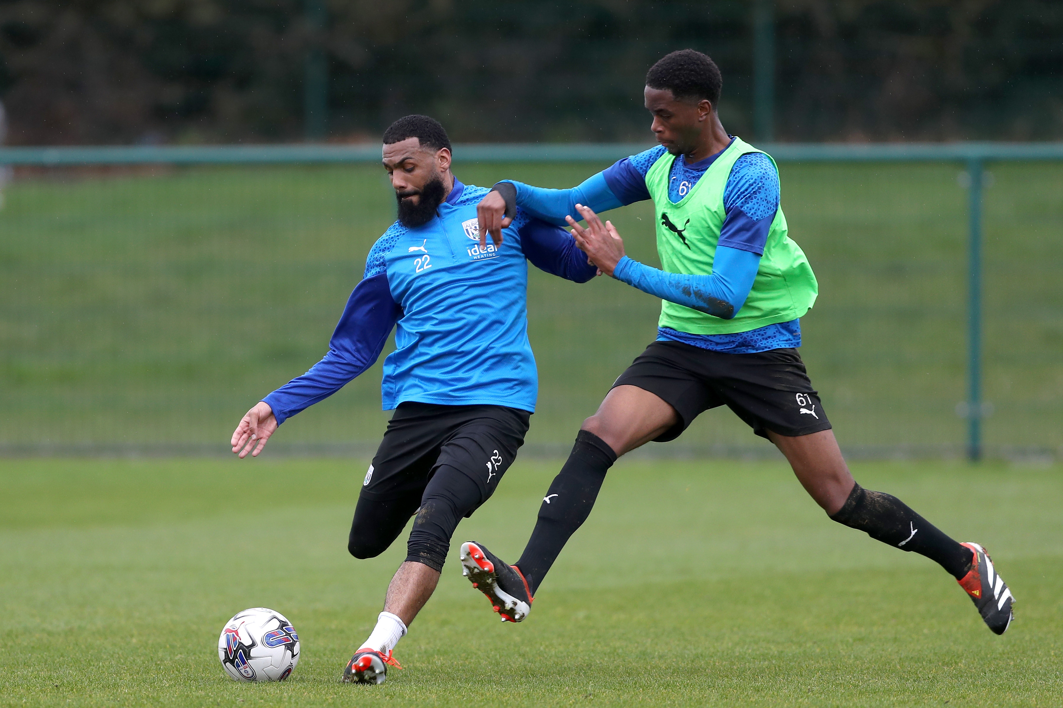 Yann M'Vila playing a pass during a training session