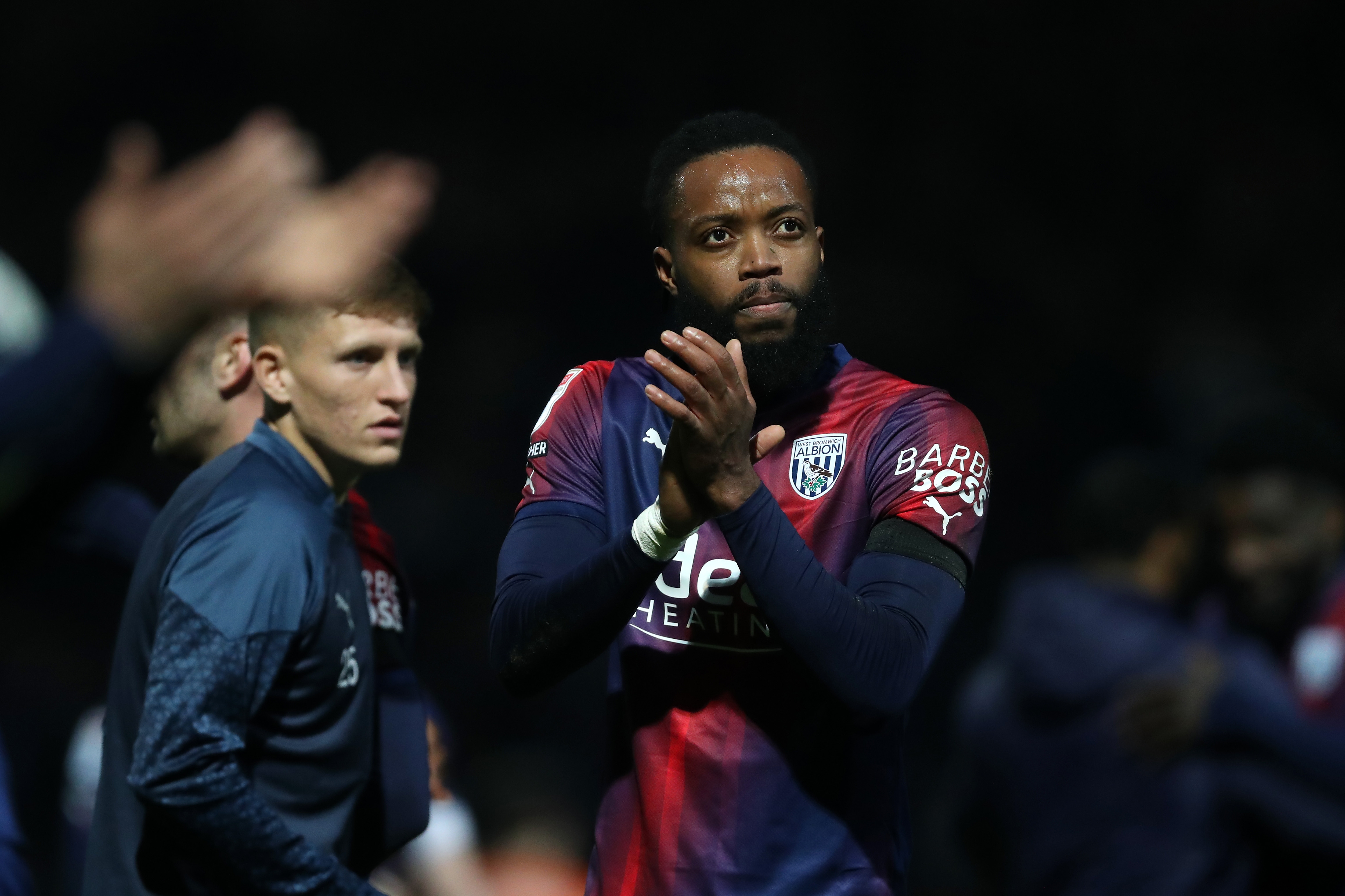 Nathaniel Chalobah applauds Albion fans after the full-time whistle at QPR 