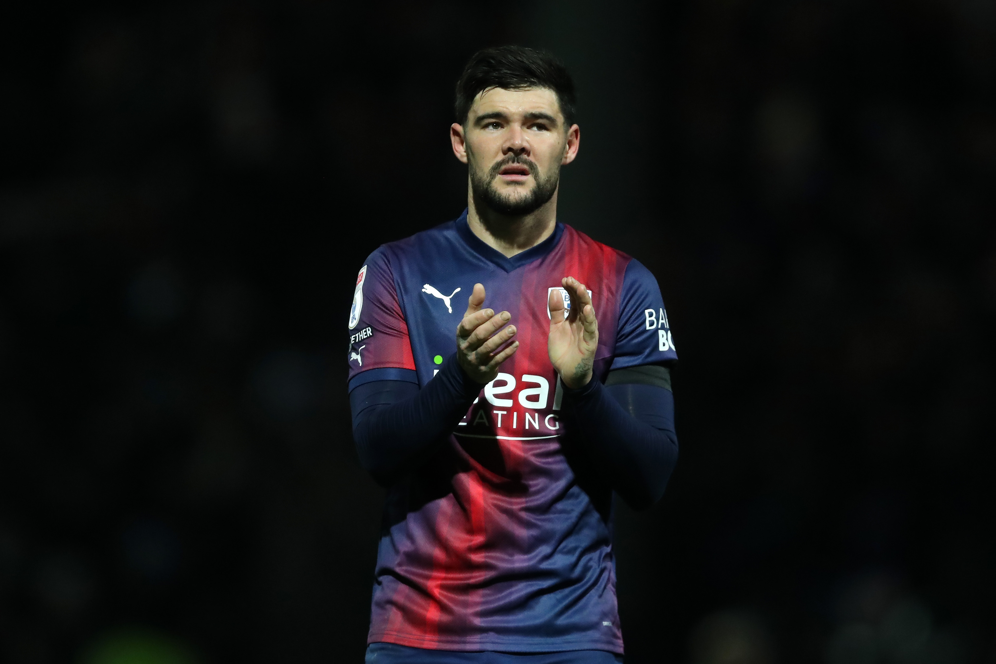 Alex Mowatt applauds Albion fans after the full-time whistle at QPR 