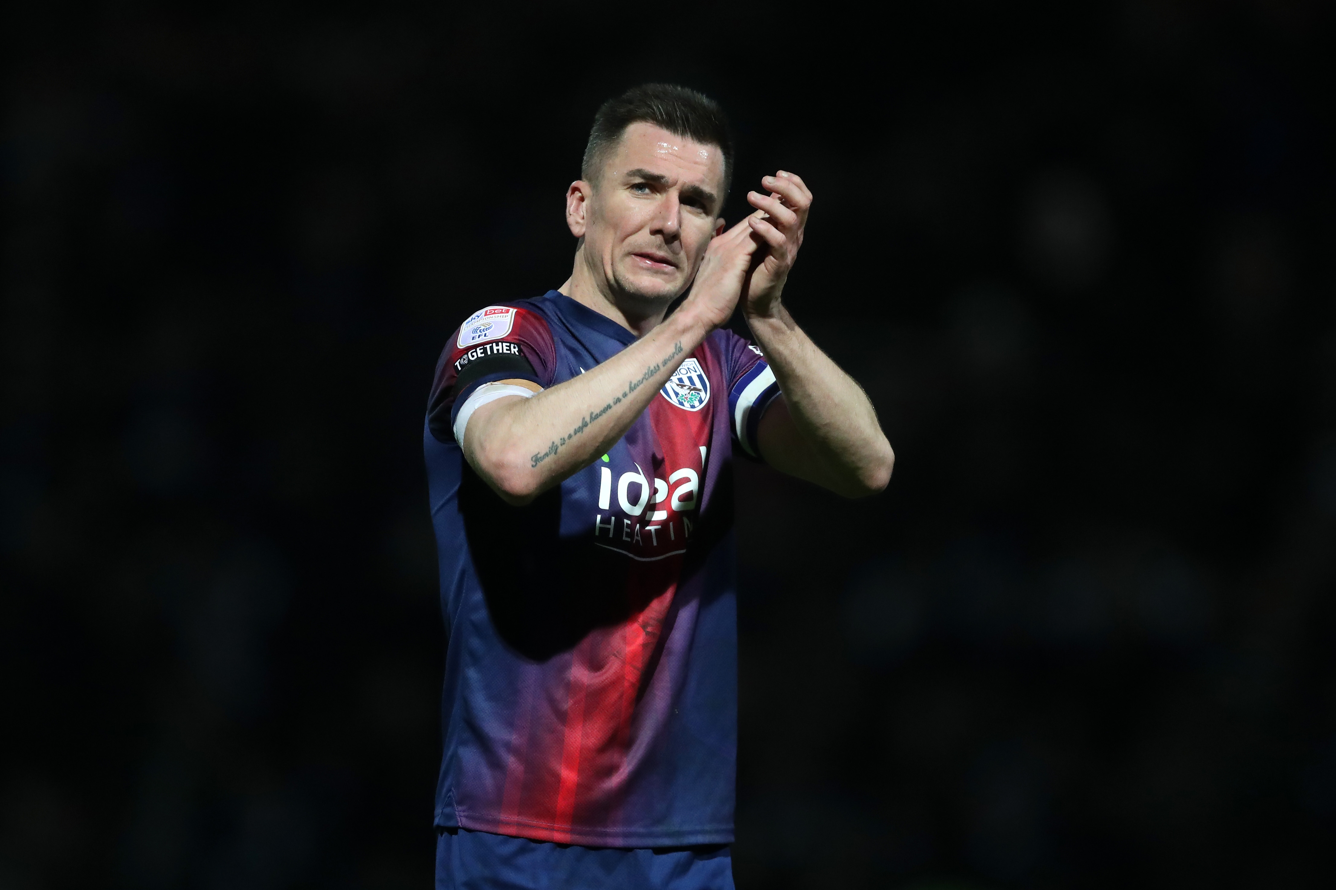 Jed Wallace applauds Albion fans after the full-time whistle at QPR 