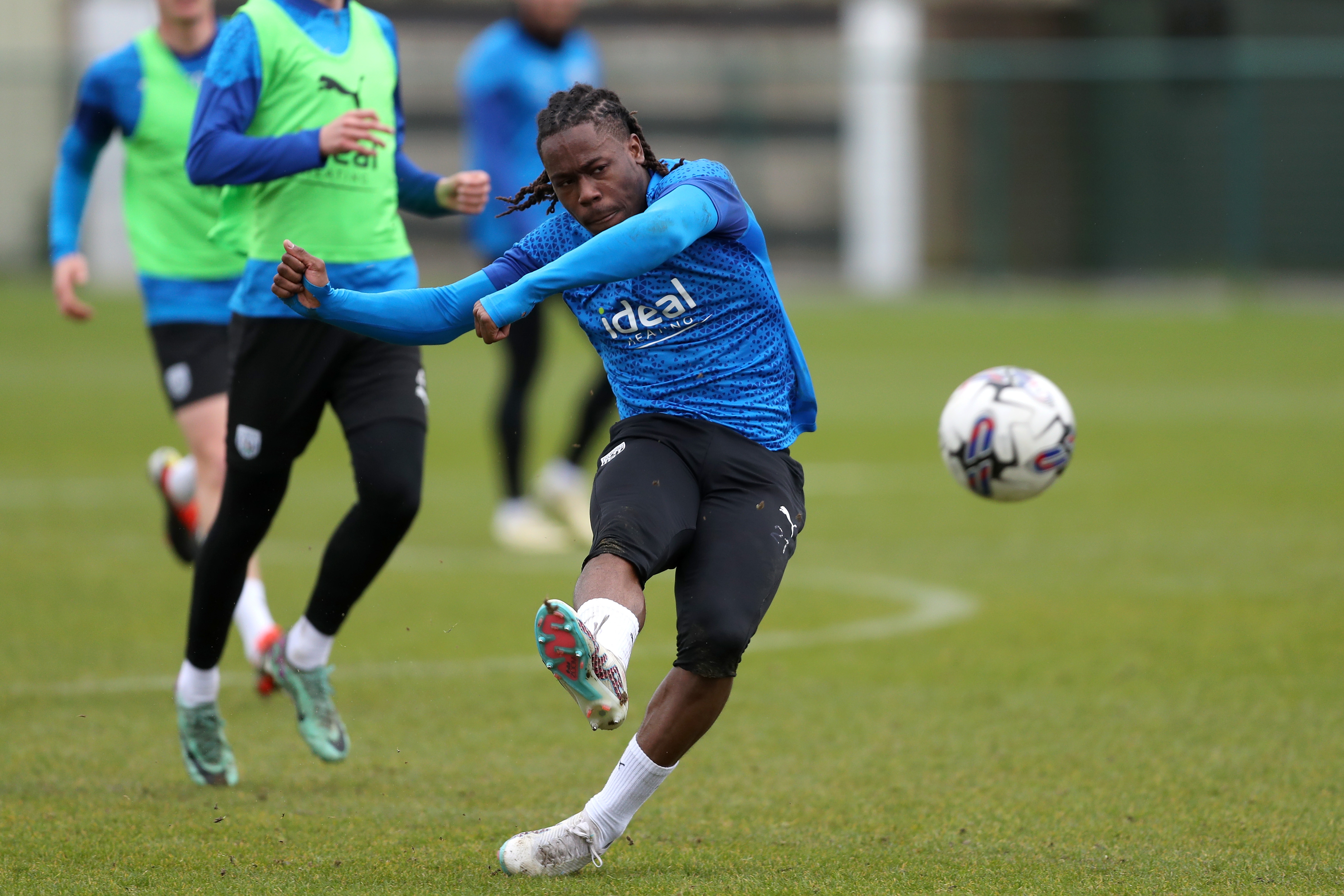 Brandon Thomas-Asante strikes the ball during a training session