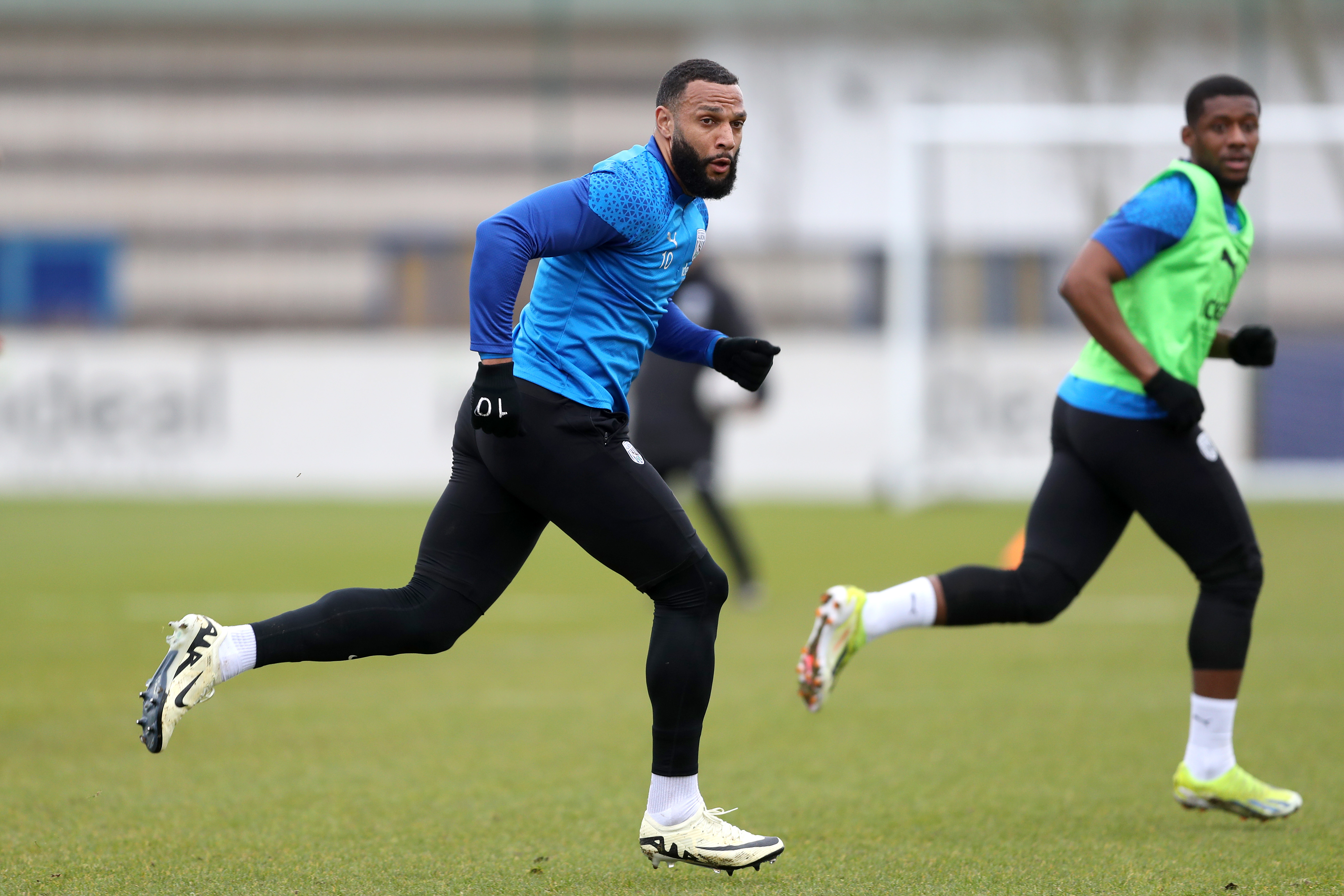 Matty Phillips running during a training session
