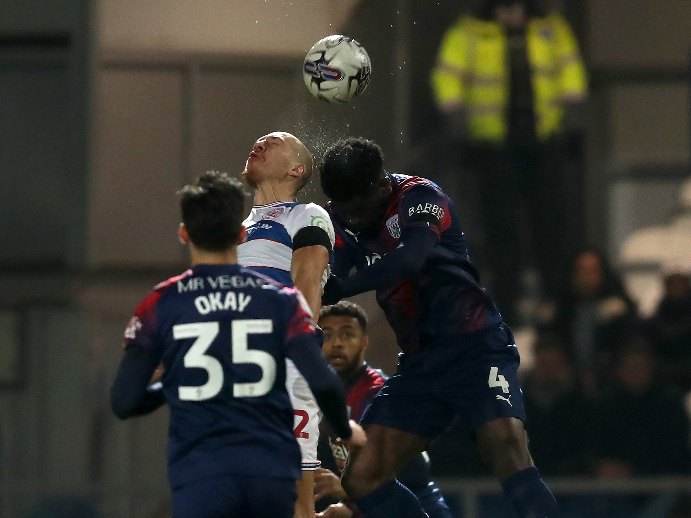 Cedric Kipre jumps for the ball against a QPR player