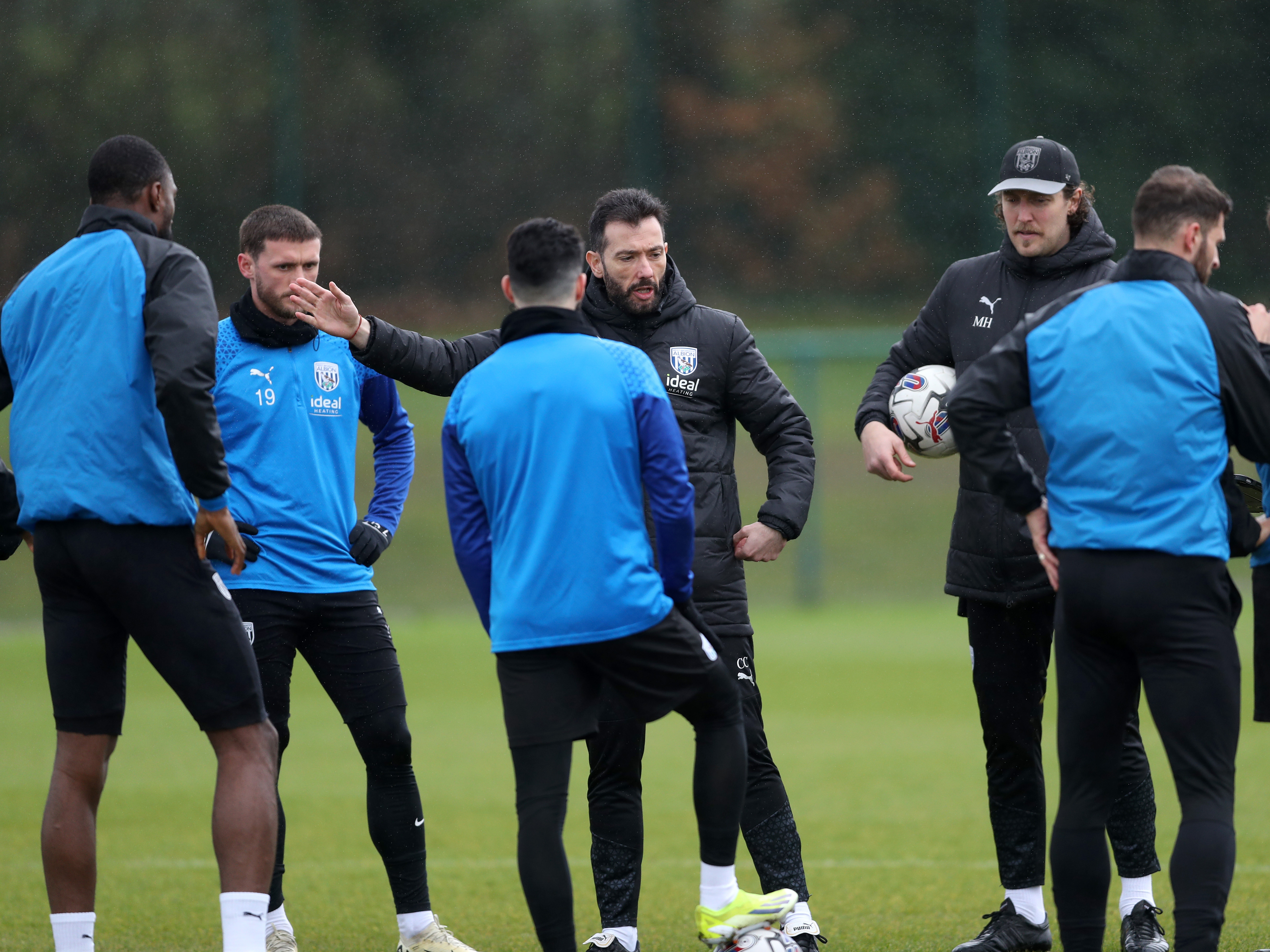 Carlos Corberan delivers info to his squad during a training session