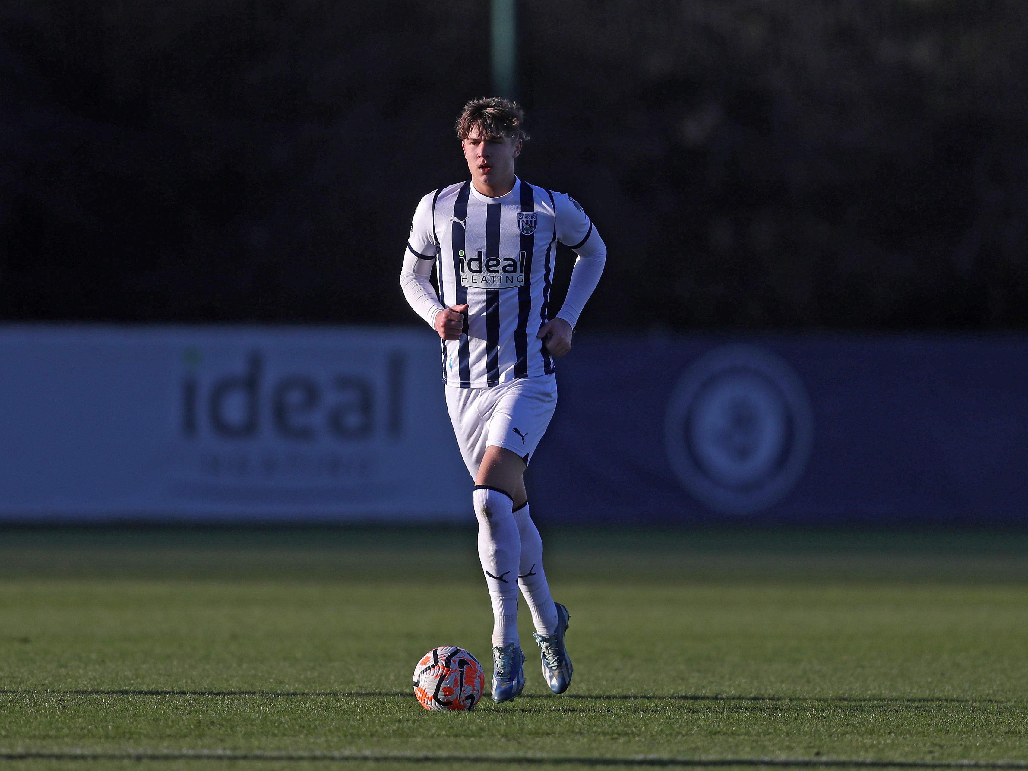 A photo of Albion youngster Cole Deeming, in the 23/24 home kit, in PL2 action at the club's training ground