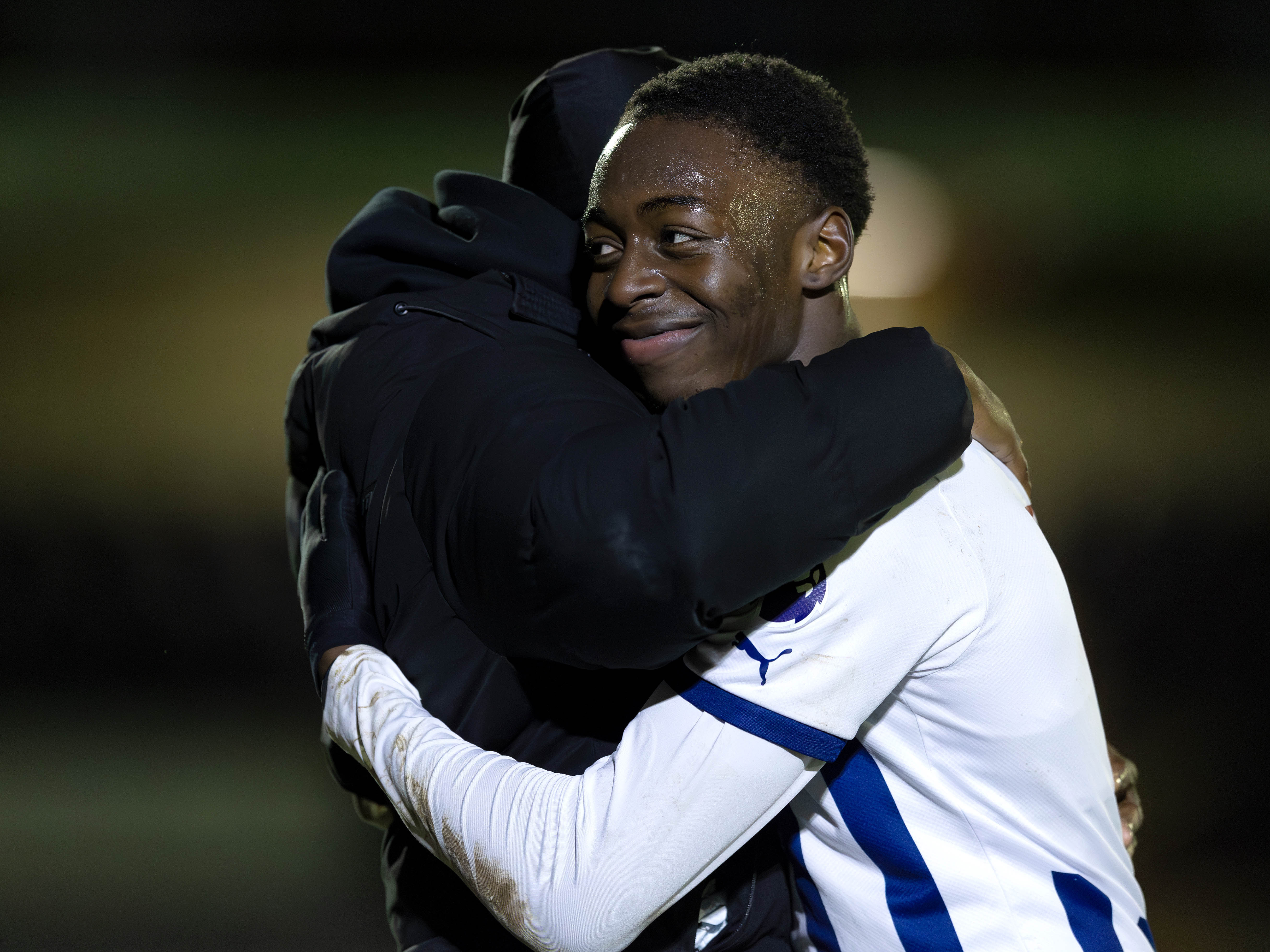 A photo of academy striker Eseosa Sule and Reyes Cleary hugging