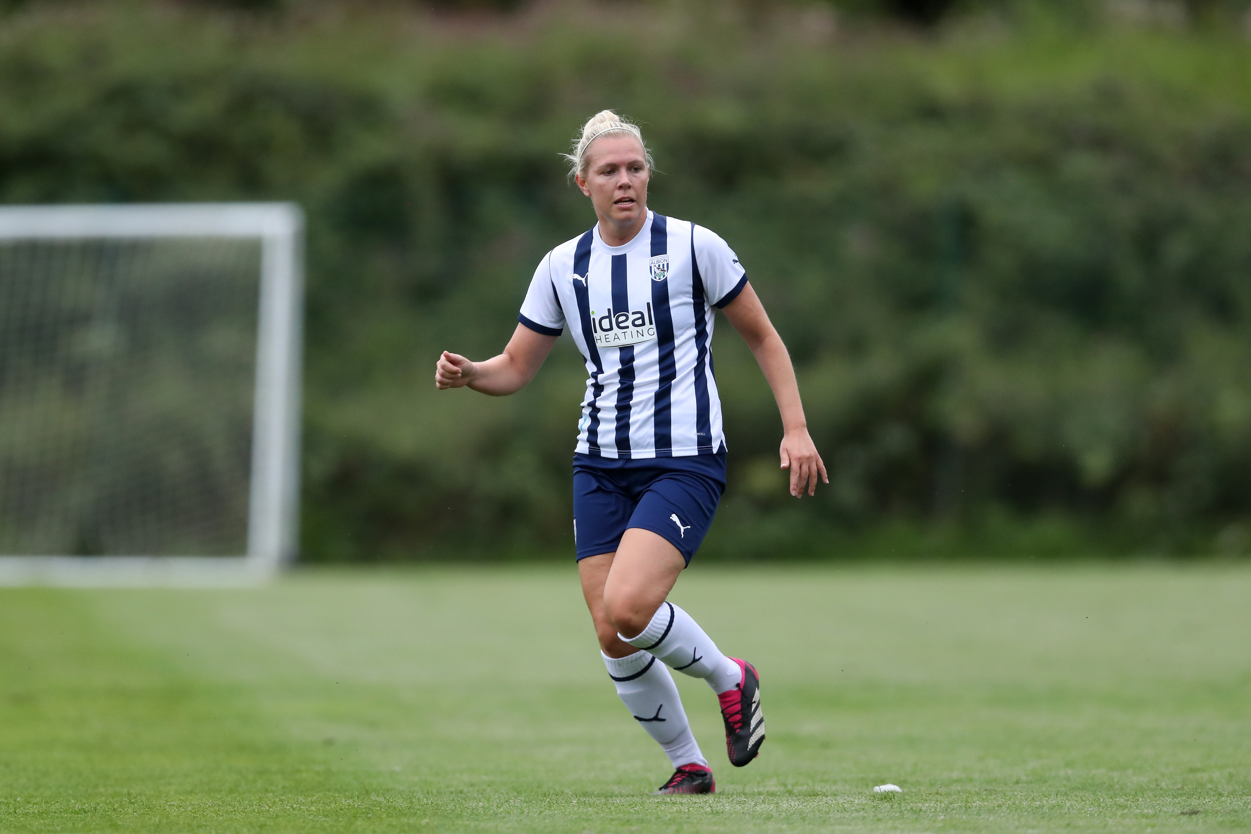 Hannah George in action for Albion Women while wearing the home kit