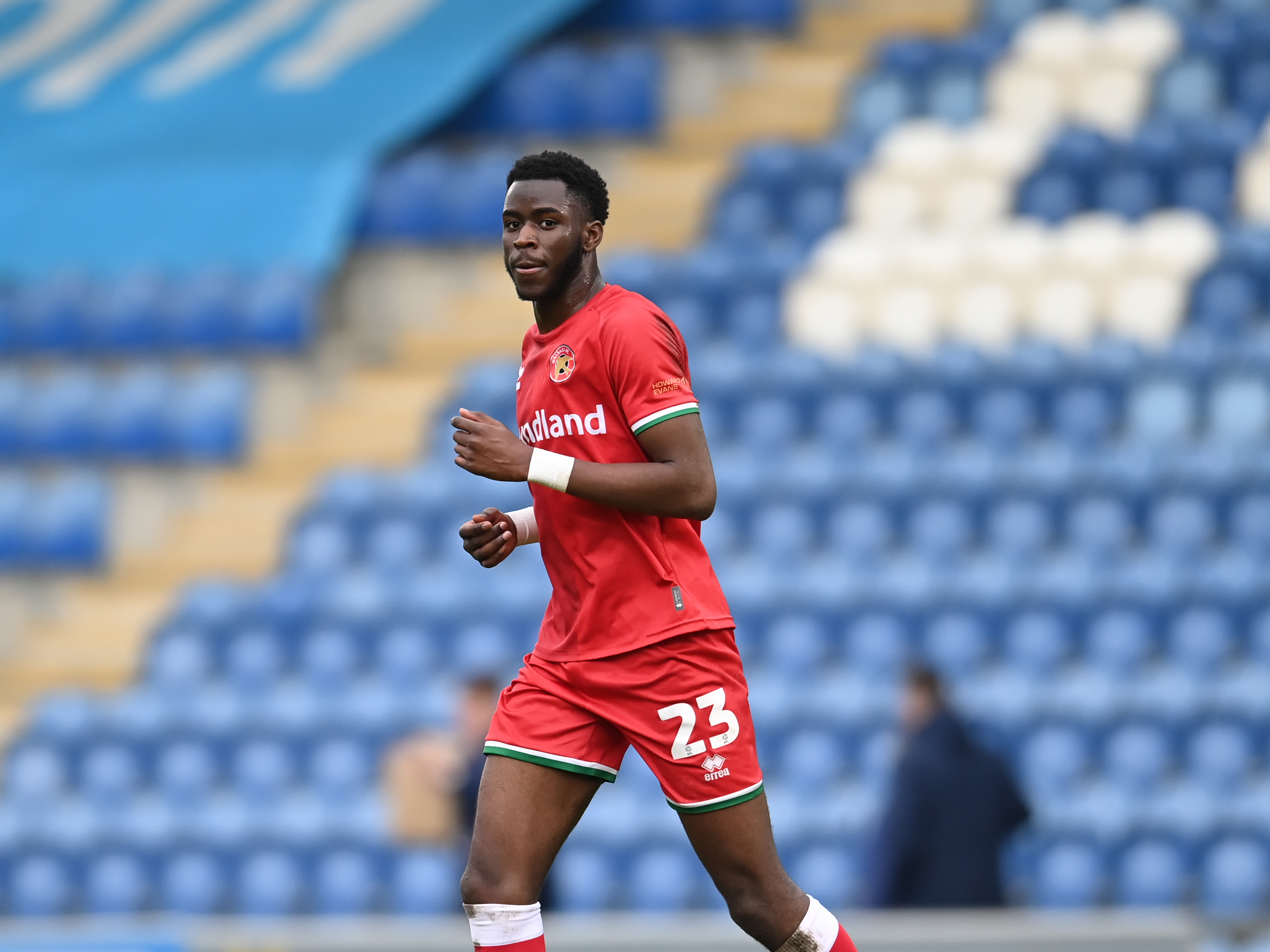 A photo of Albion man Mo Faal in action for loan club Walsall wearing their red kit