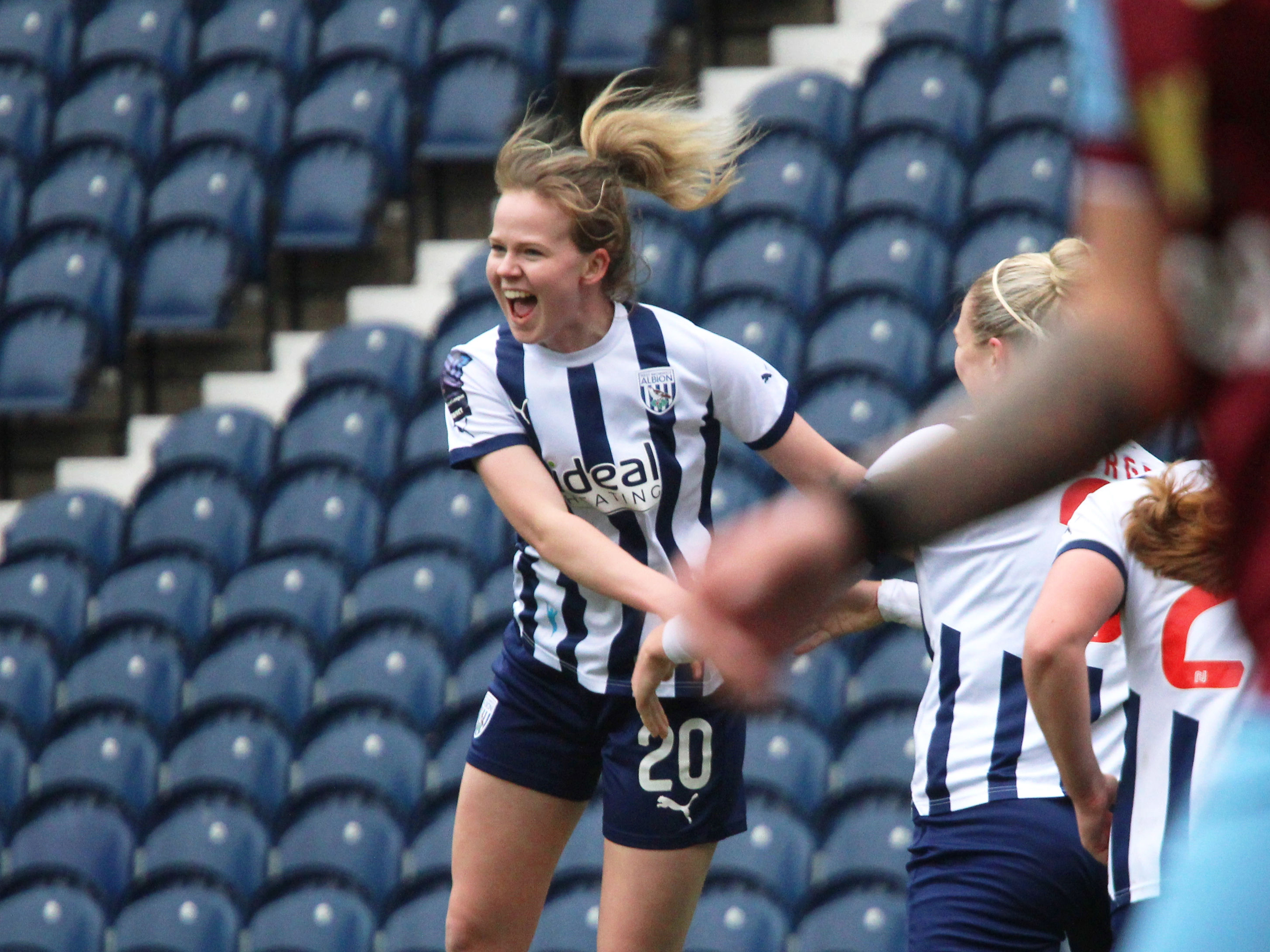 An image of Phoebe Warner celebrating her goal against Burnley