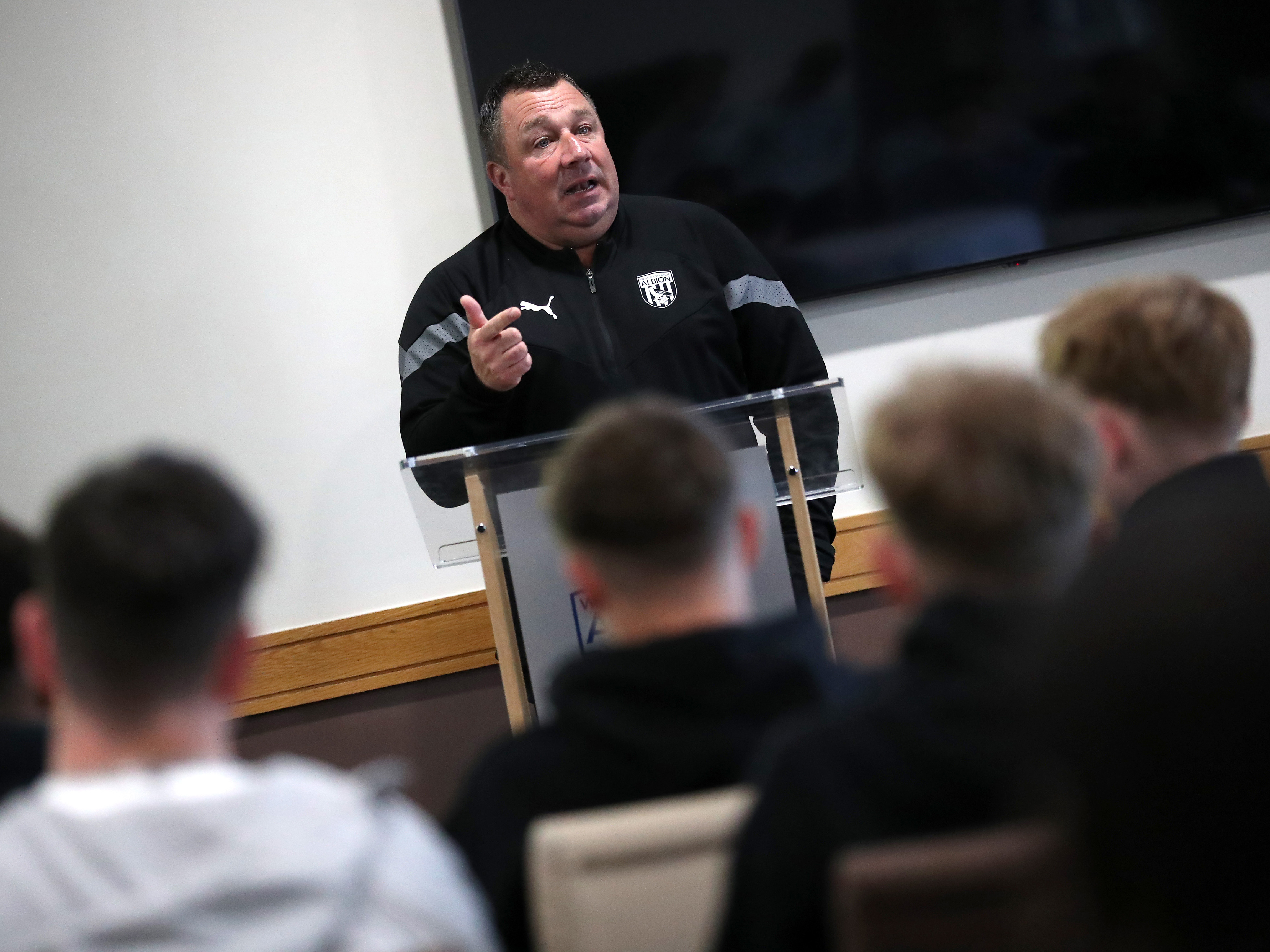 A photo of Albion Academy Manager Richard Stevens giving speech to scholars at The Hawthorns 