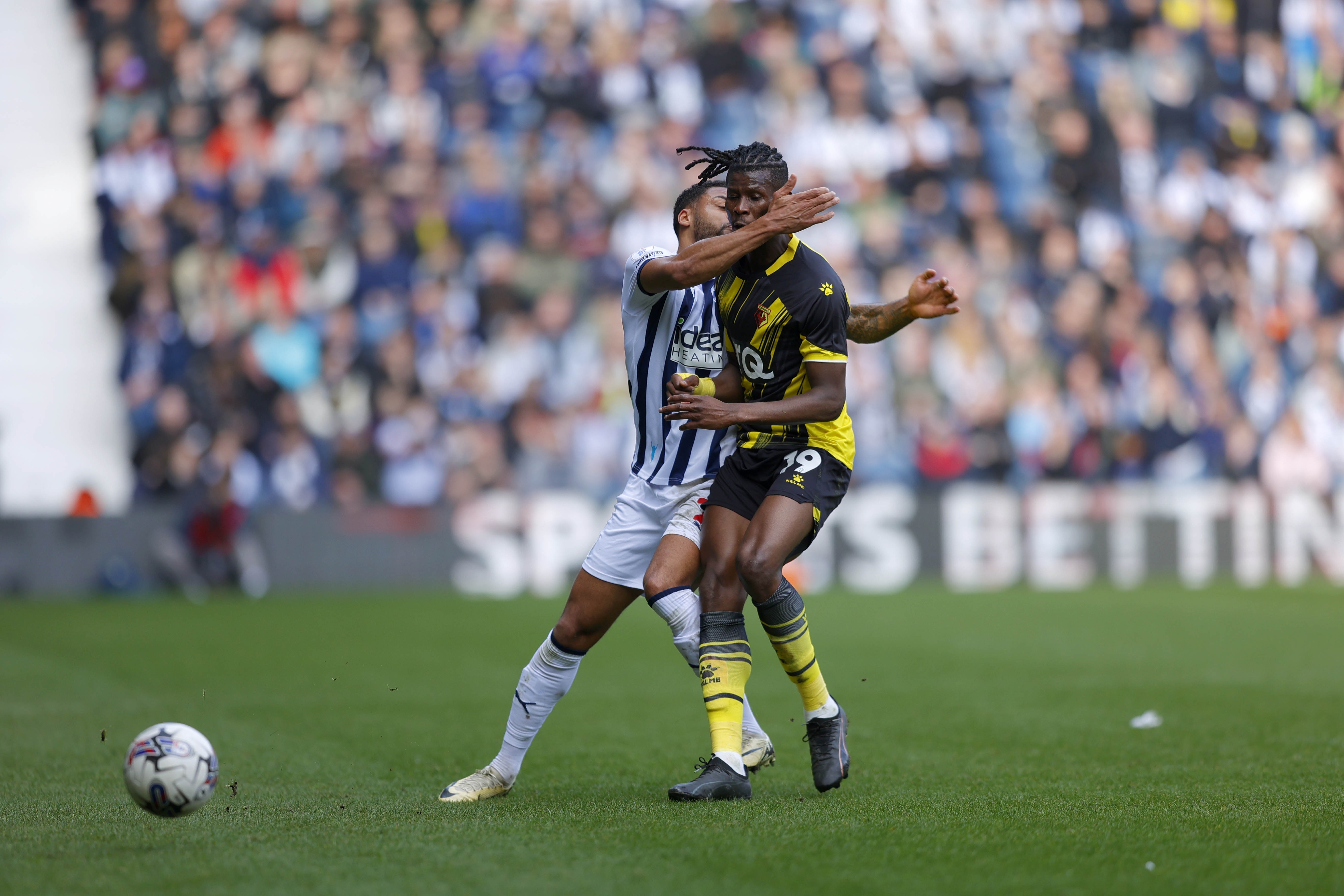 Darnell Furlong collides with a Watford player