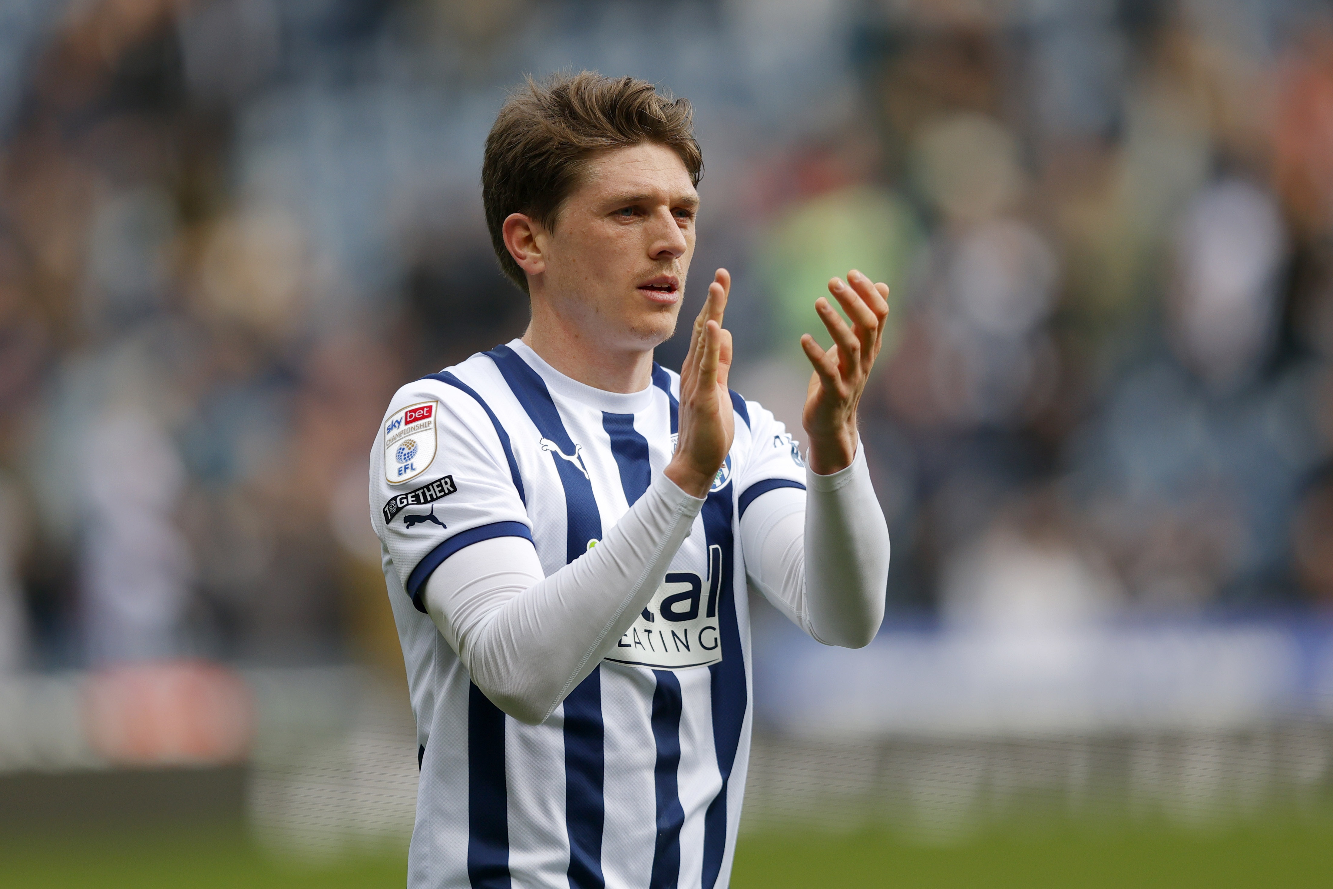 Adam Reach applauding supporters after the Watford game