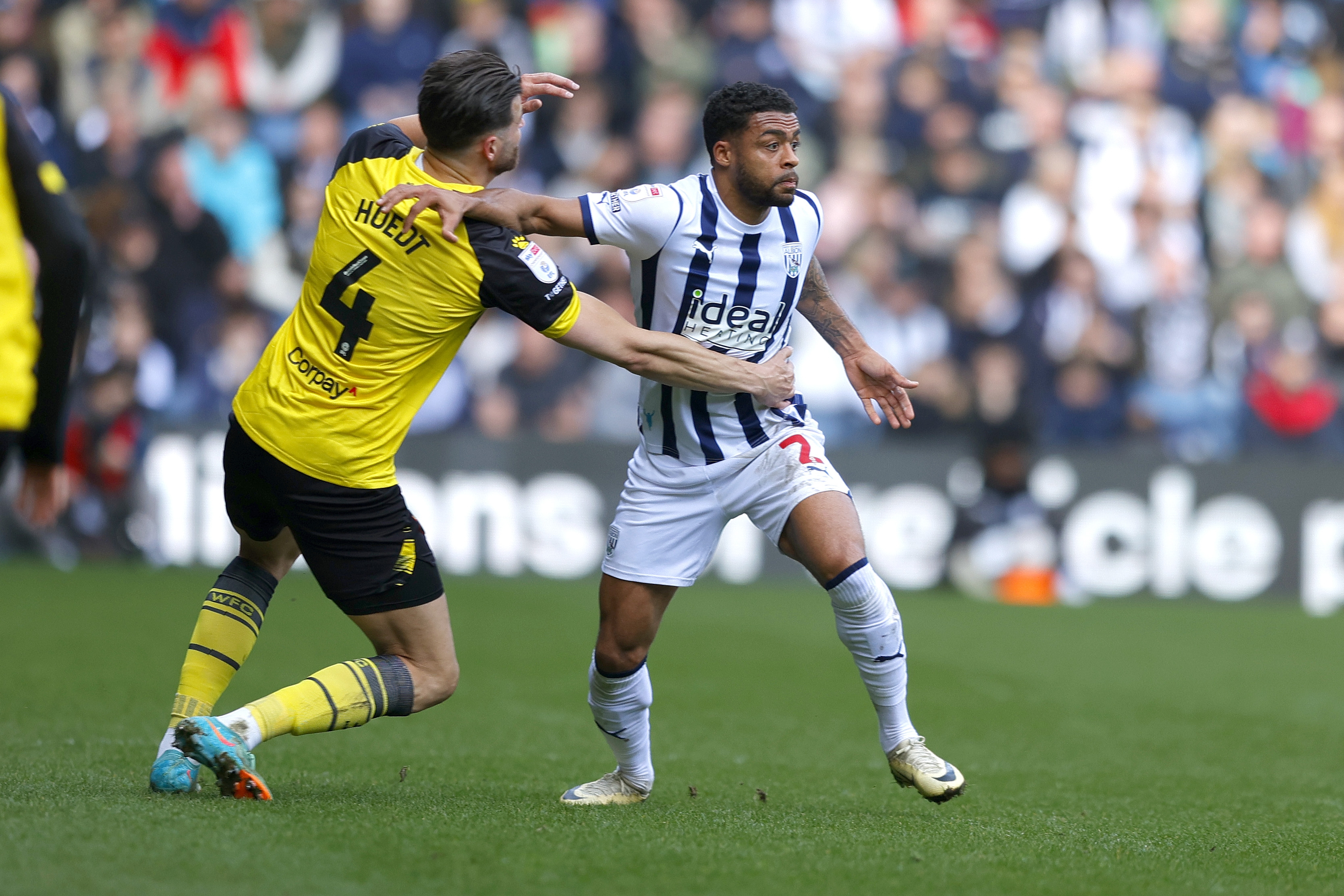 Darnell Furlong battles with a Watford player