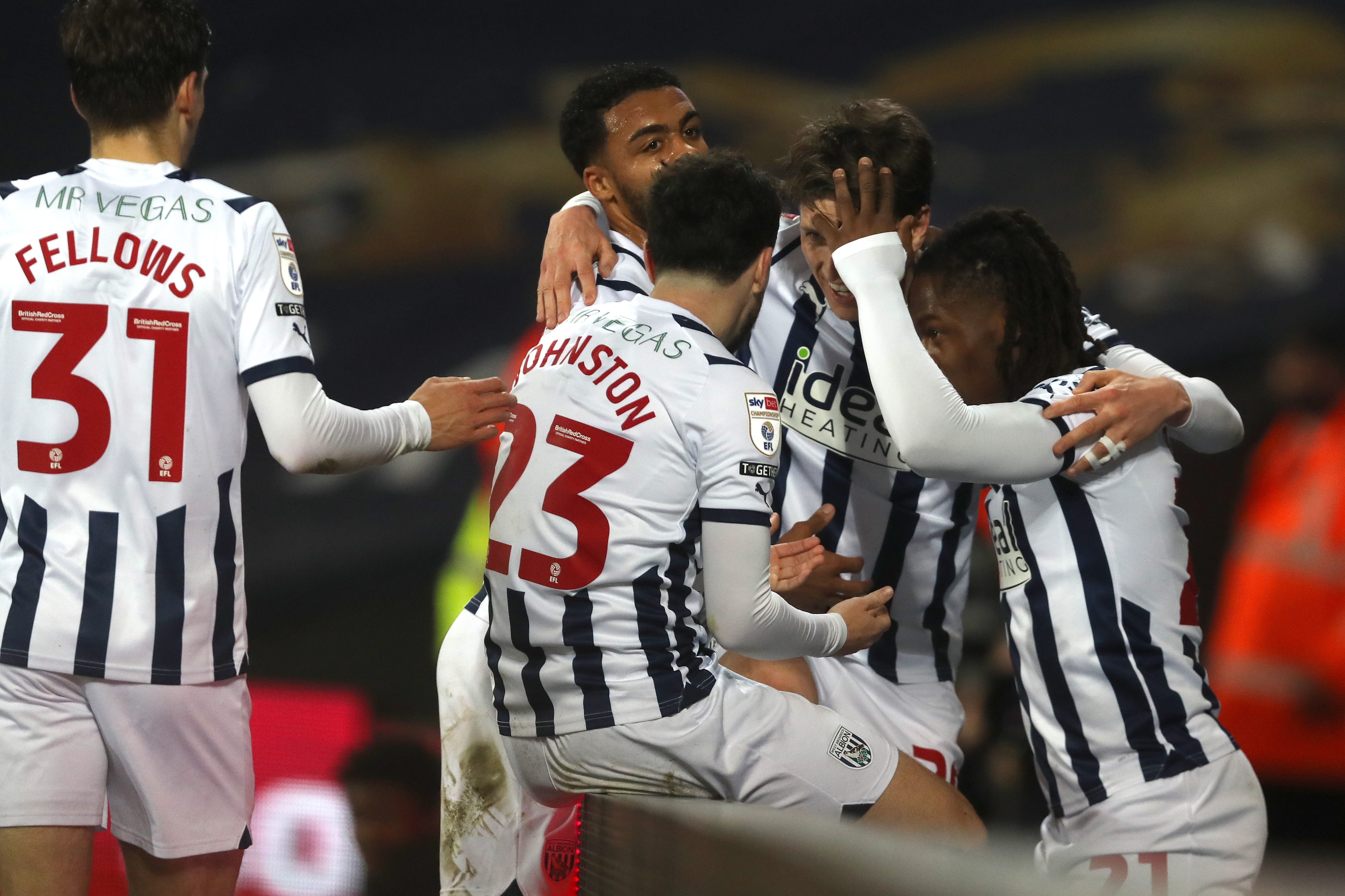 Adam Reach is mobbed by team-mates after setting up Brandon Thomas-Asante's goal against Rotherham at The Hawthorns