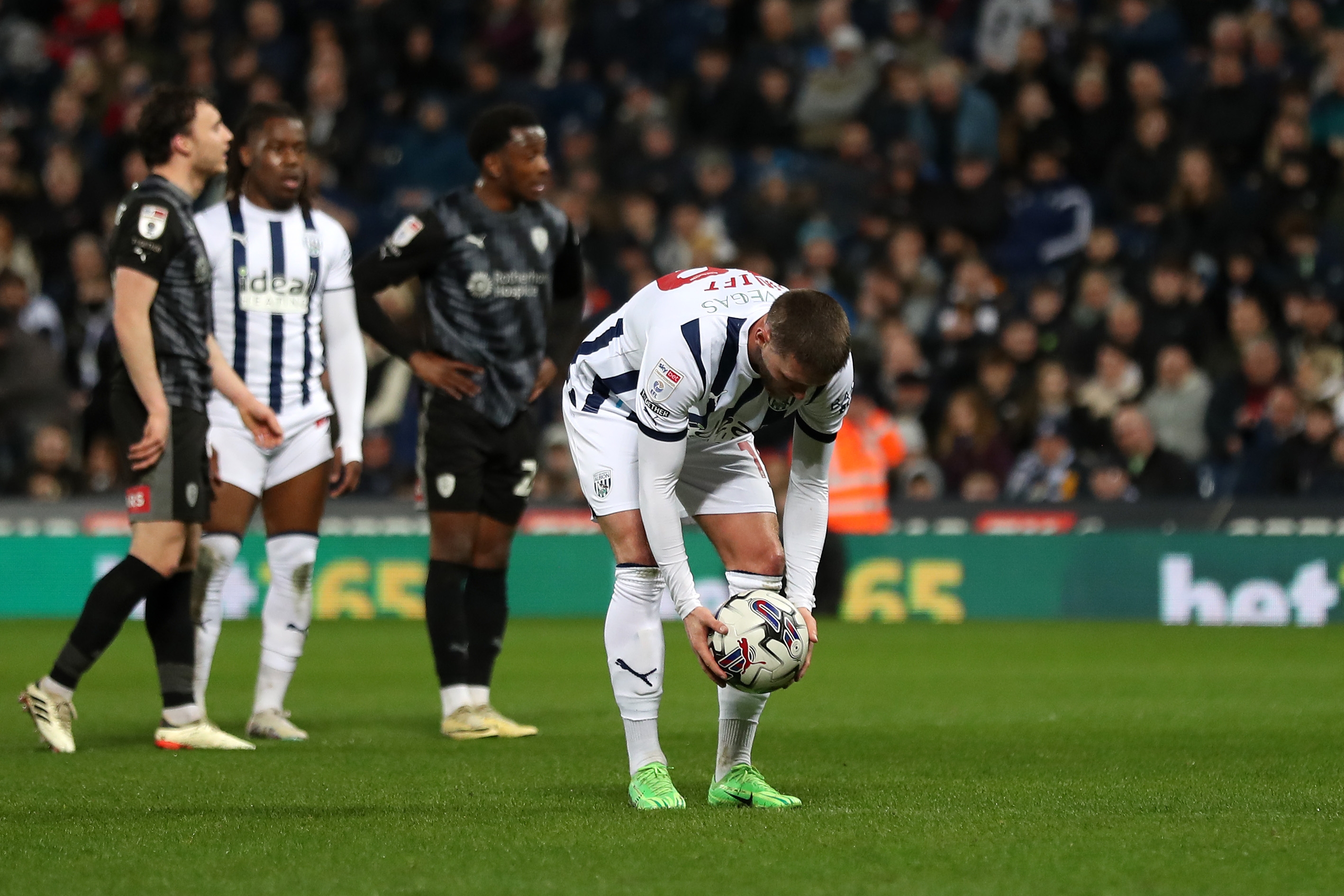 John Swift places the ball on the penalty spot against Rotherham United at The Hawthorns