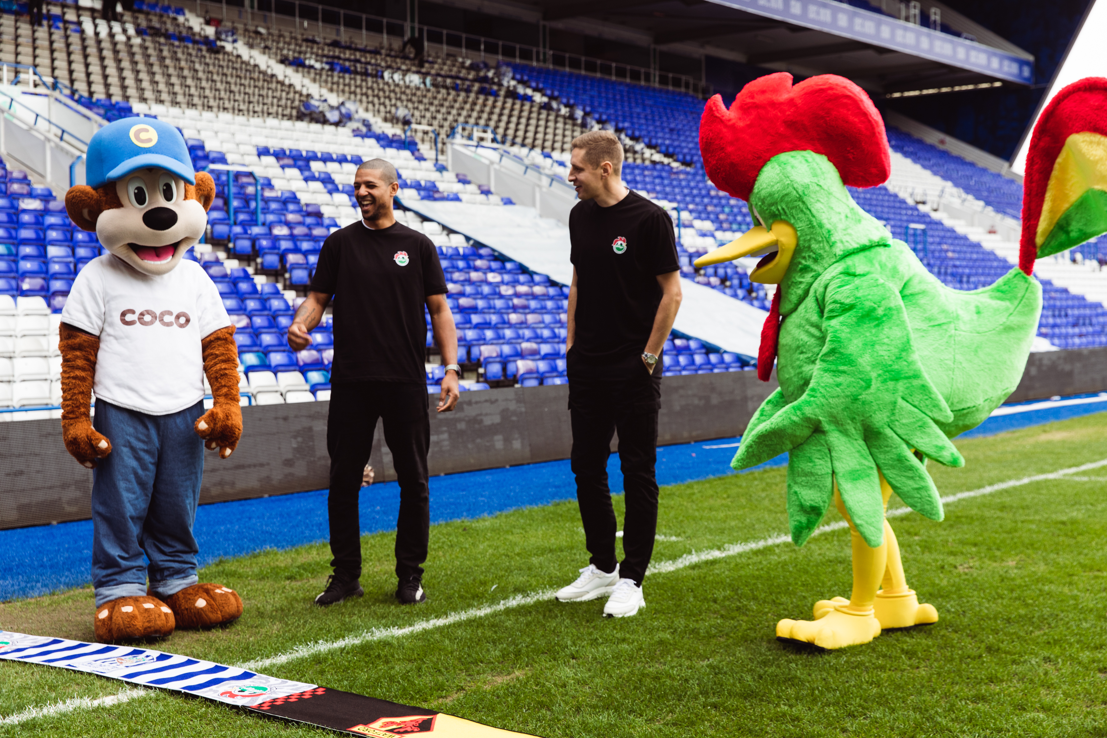 Kelloggs & Coco Pops mascots engaging with two player.