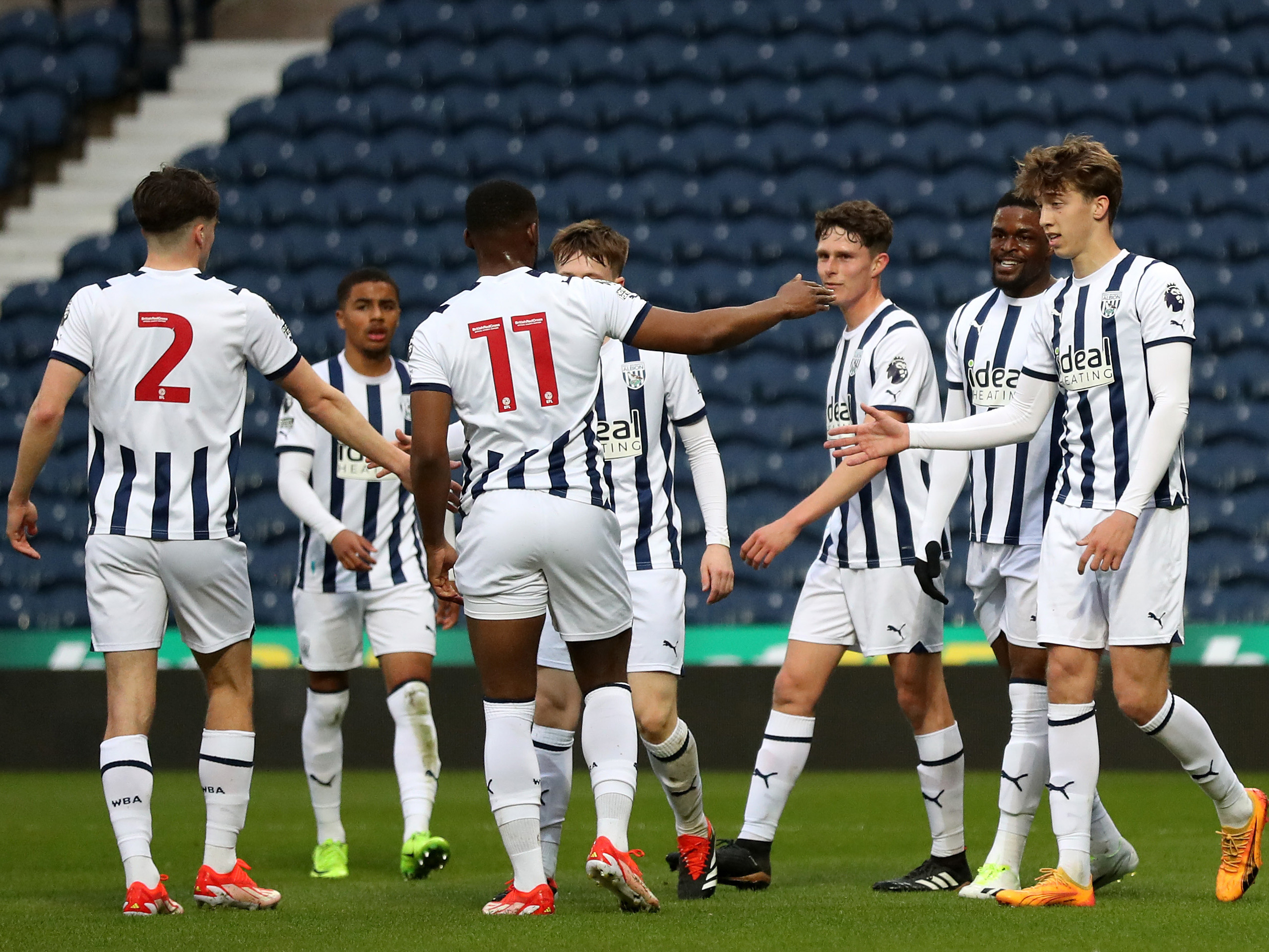 Albion's PL2 players celebrate a goal after scoring against Leeds United at The Hawthorns wearing the home kit