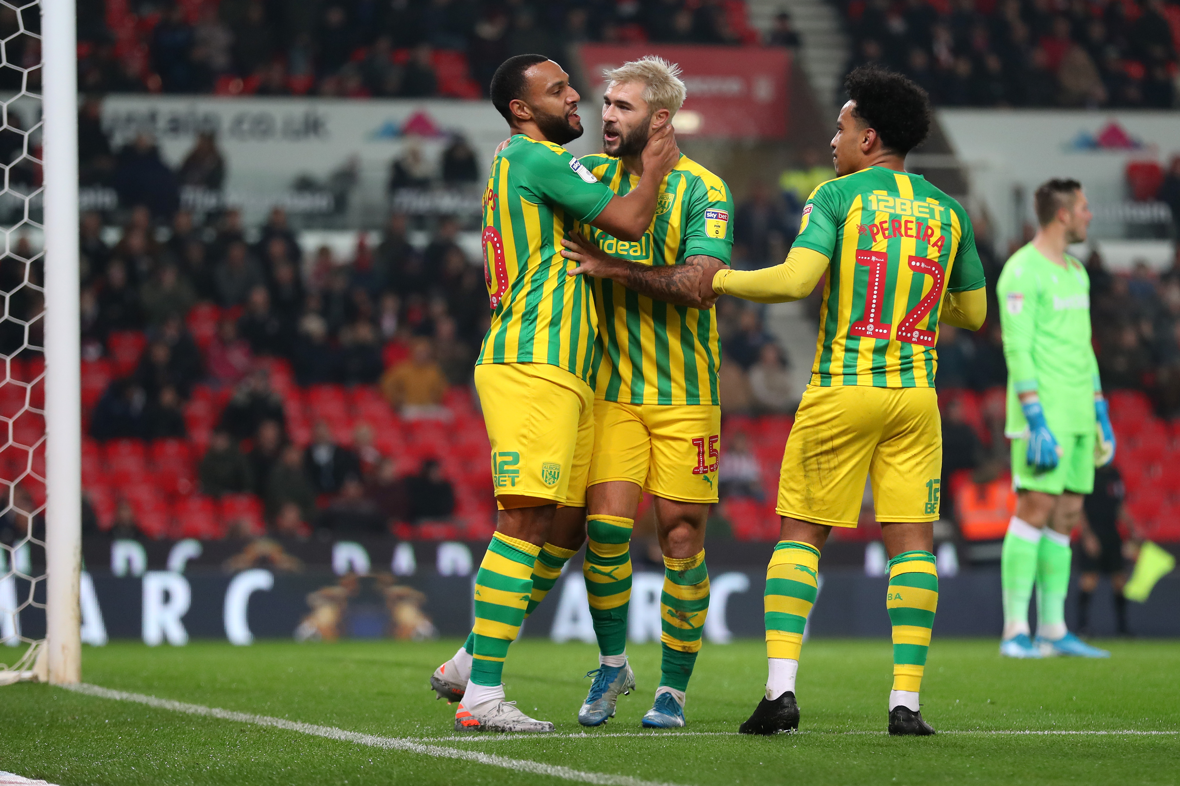 Matt Phillips celebrates scoring at Stoke City in 2019 with Charlie Austin and Matheus Pereira