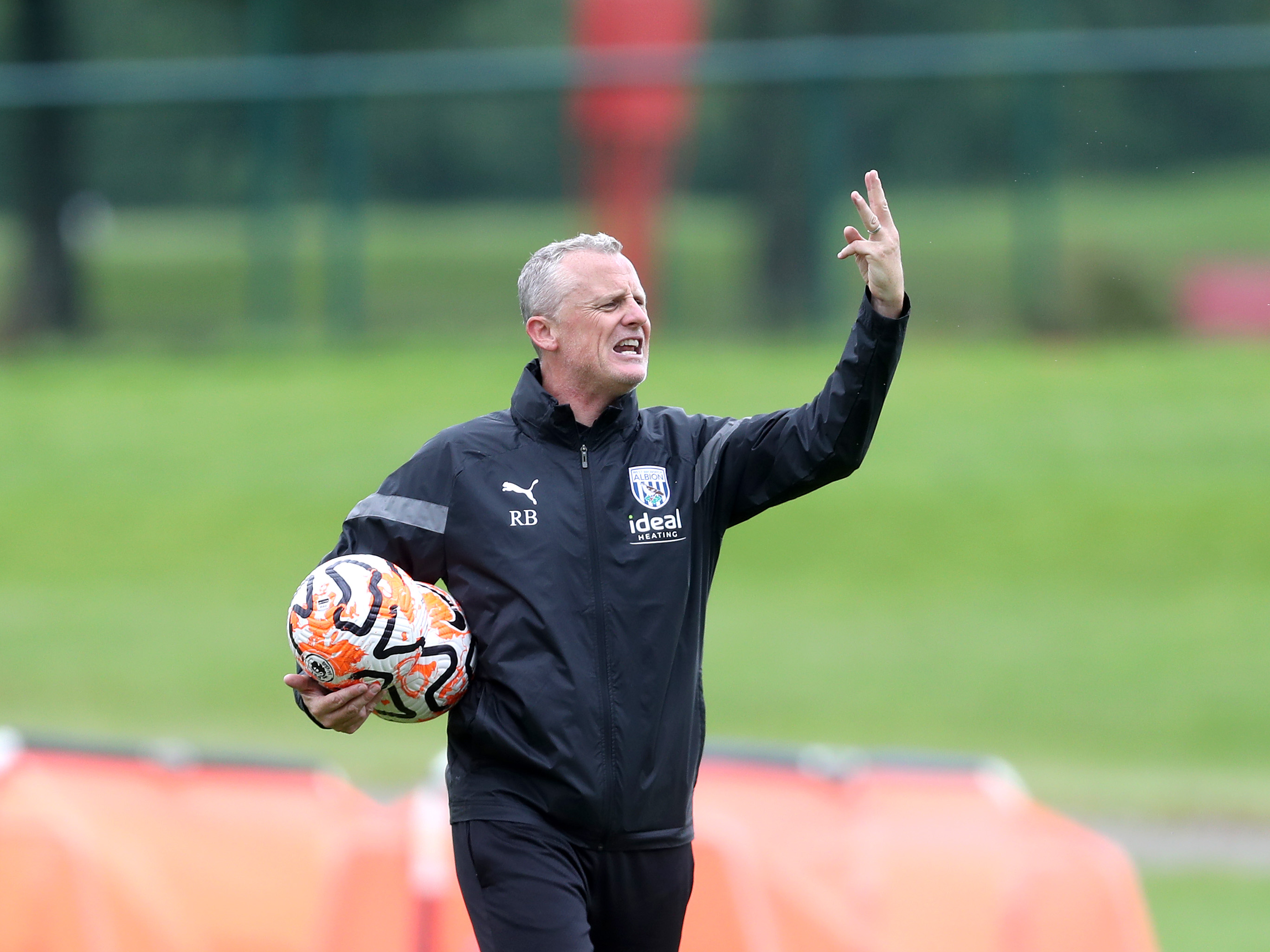 A photo of Albion U21s boss Richard Beale, in 23/24 black training wear, at the club's training ground going out instructions
