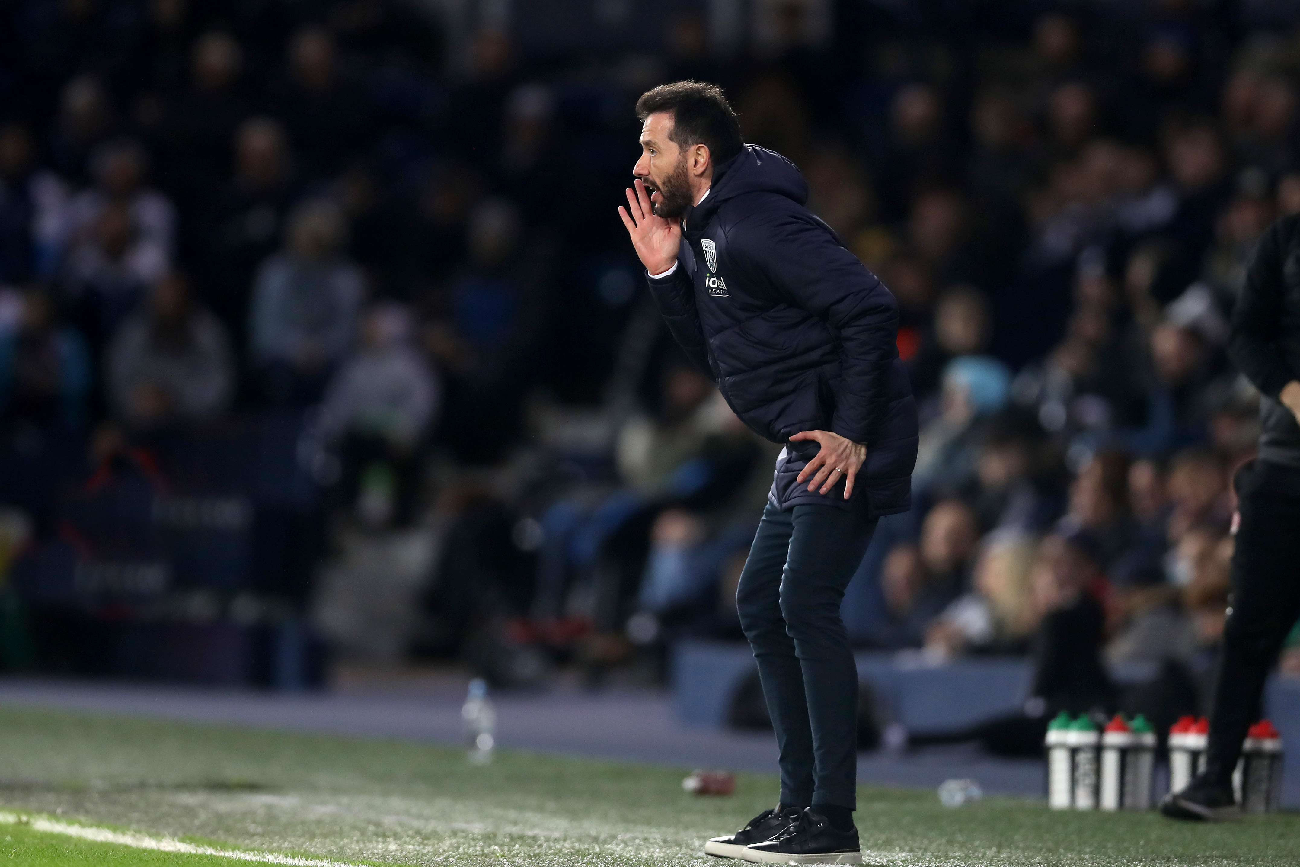 Carlos Corberán shouting to his players on the side of the pitch at The Hawthorns
