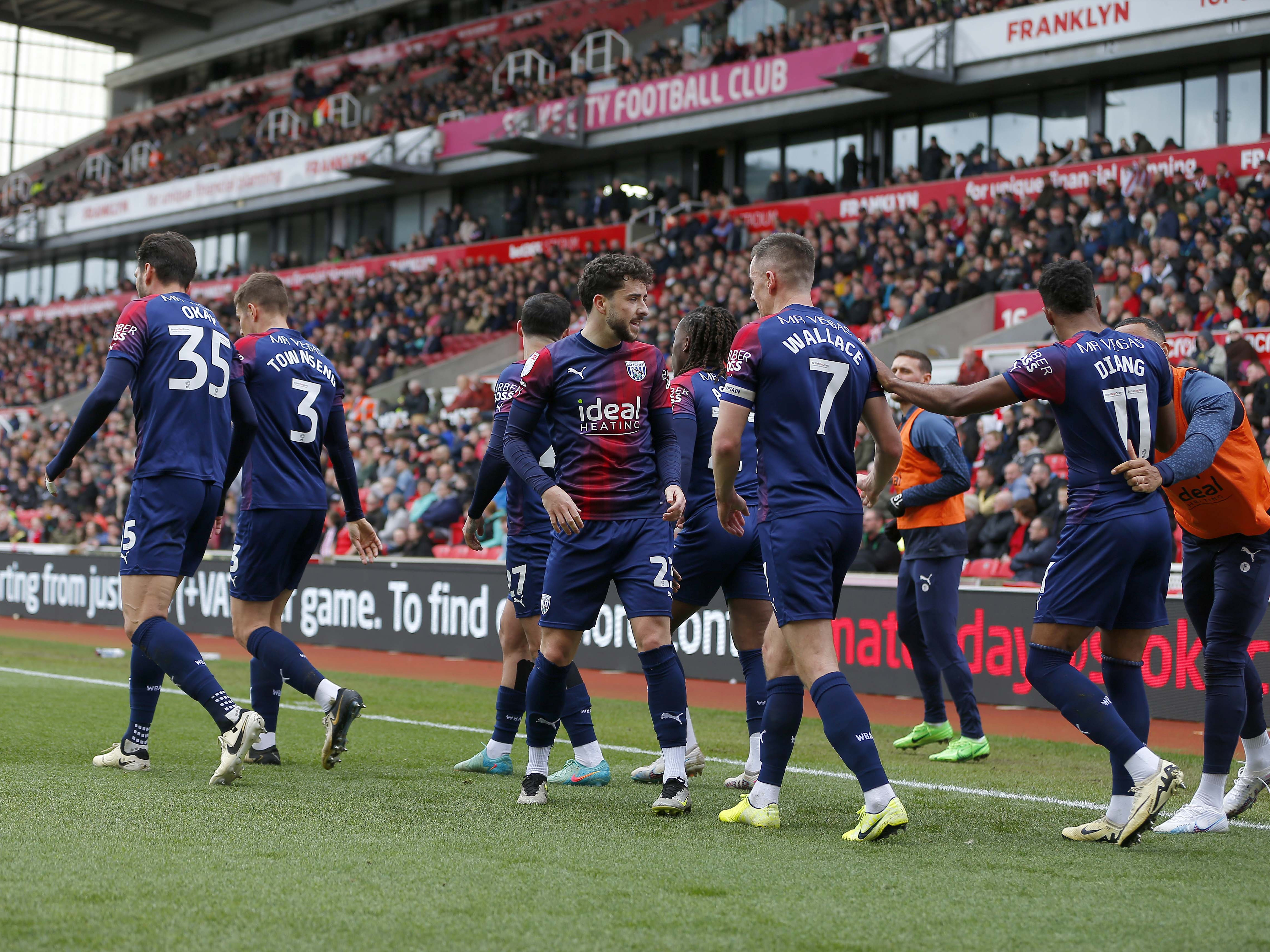 An image of Albion's squad celebrating a goal together at Stoke