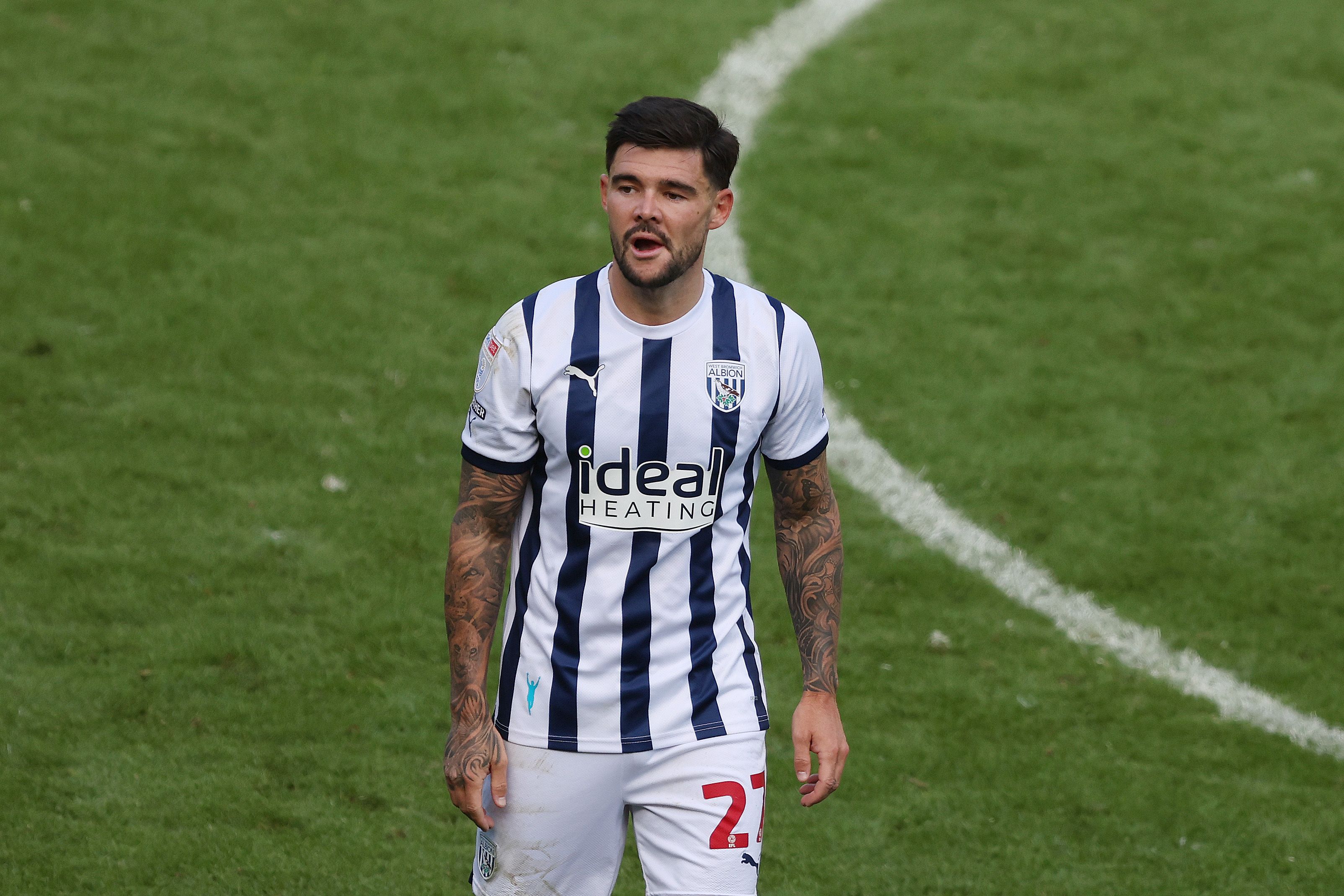 Alex Mowatt in action for Albion wearing the home kit