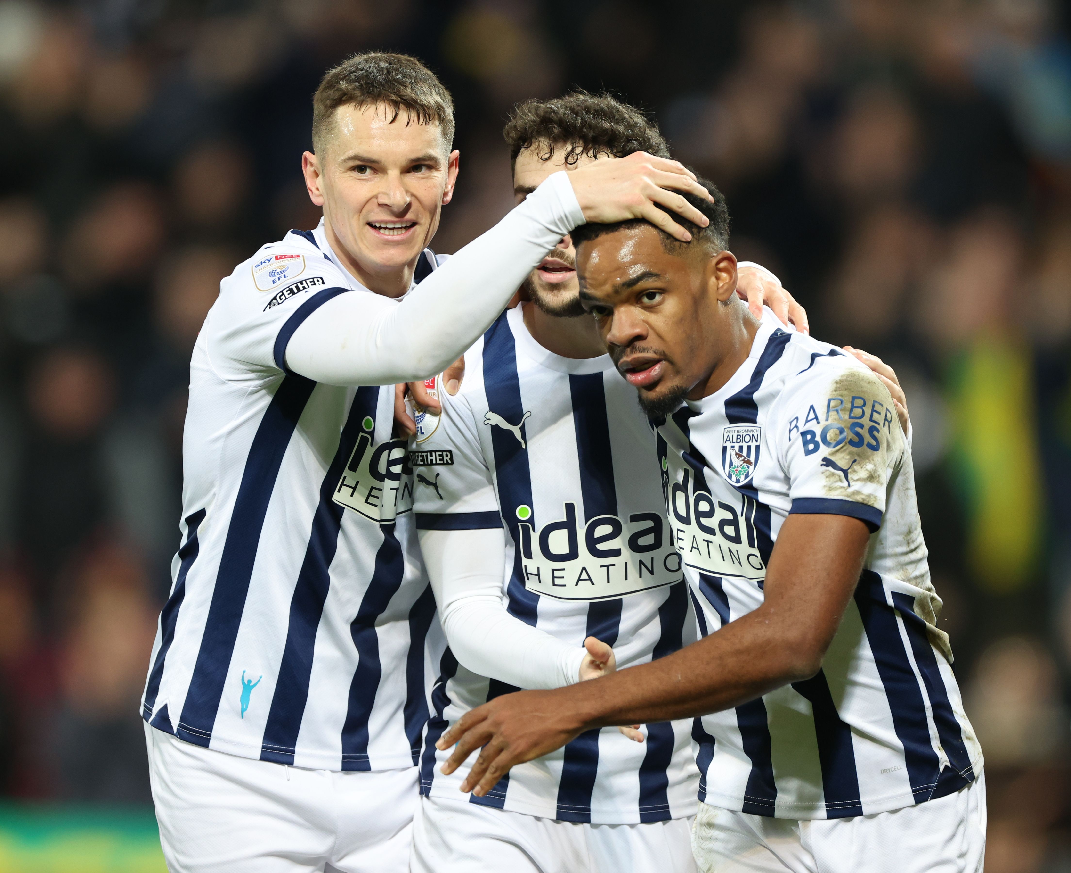 Conor Townsend, Mikey Johnston and Grady Diangana celebrate an Albion goal in the home kit
