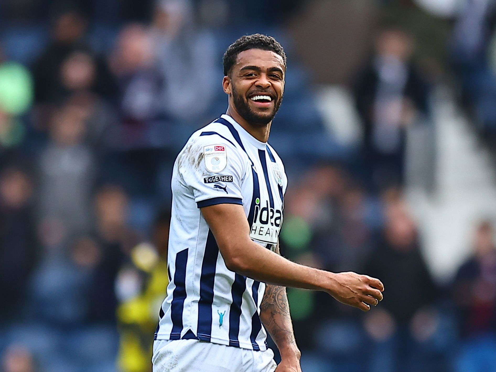 Darnell Furlong smiling after scoring against Watford at The Hawthorns