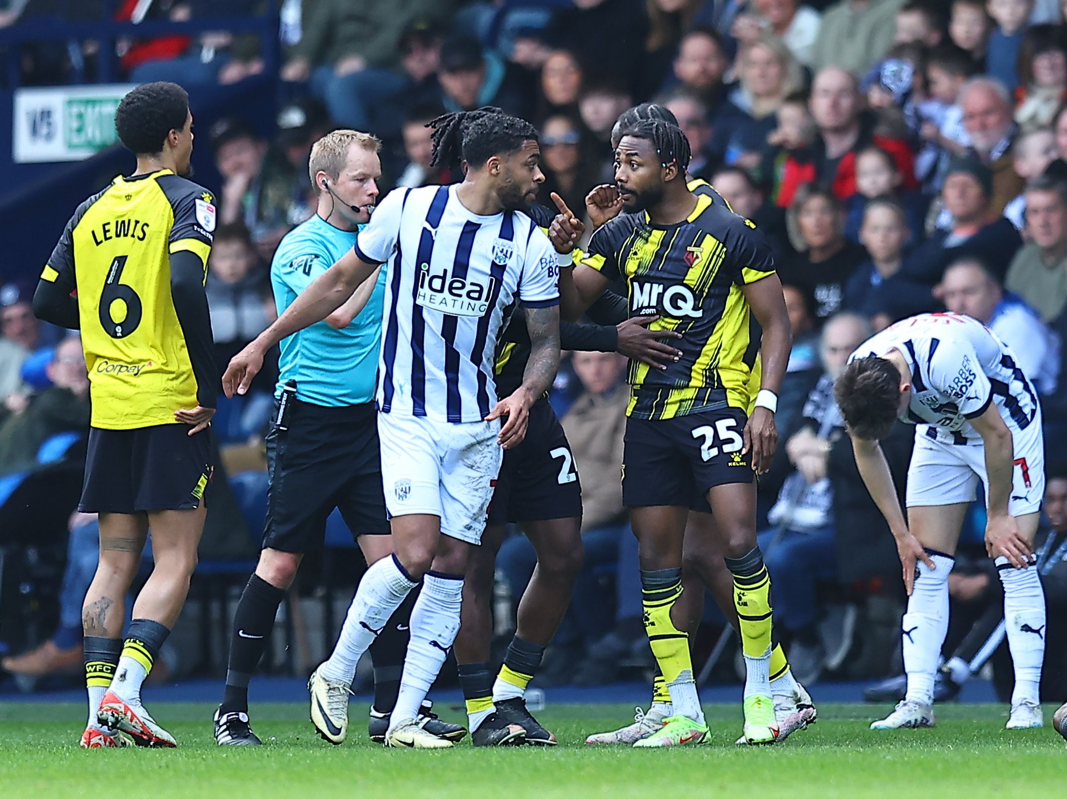 Darnell Furlong clashes with a Watford player 