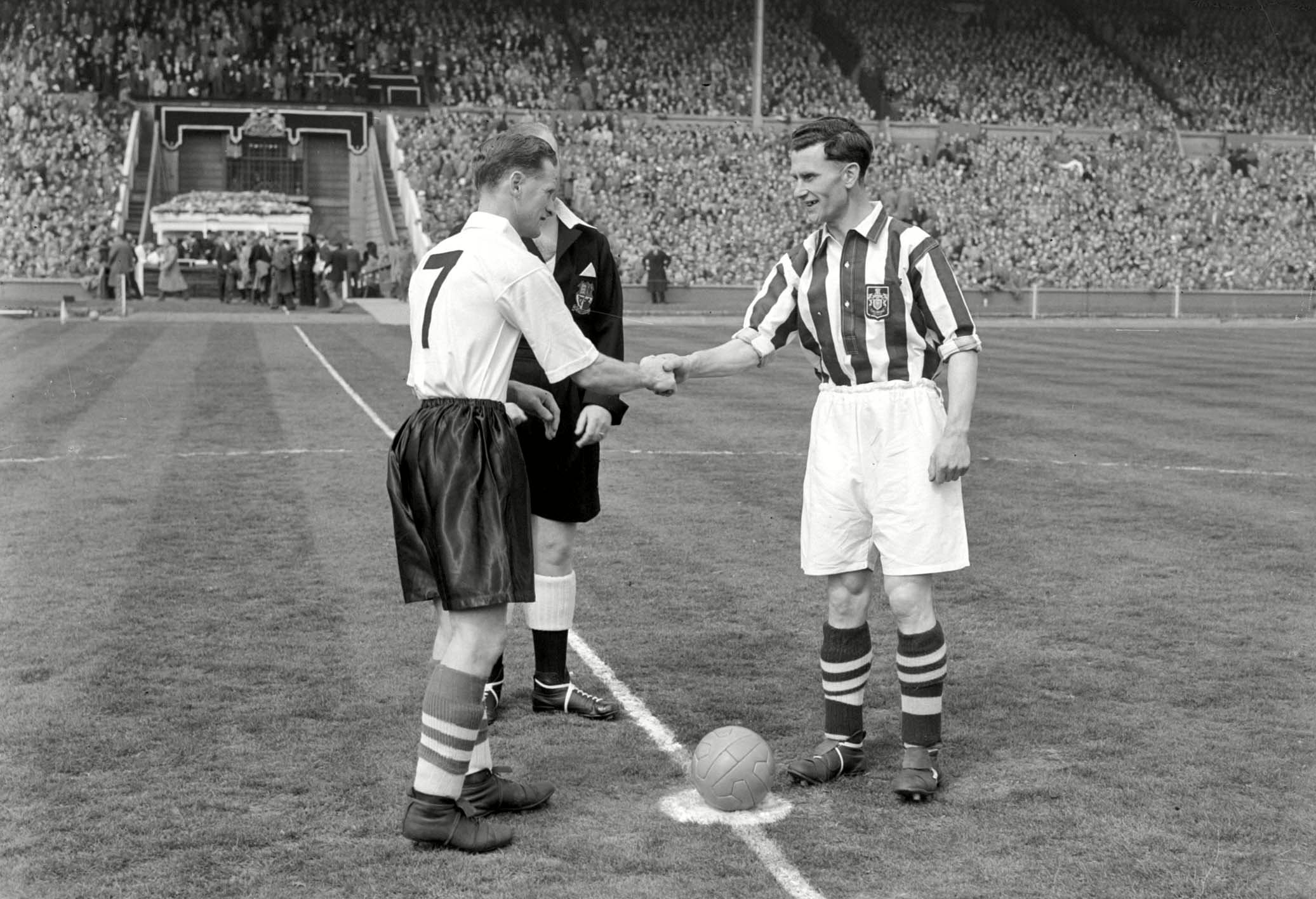 The two 1954 FA Cup final captains shake hands before kick-off