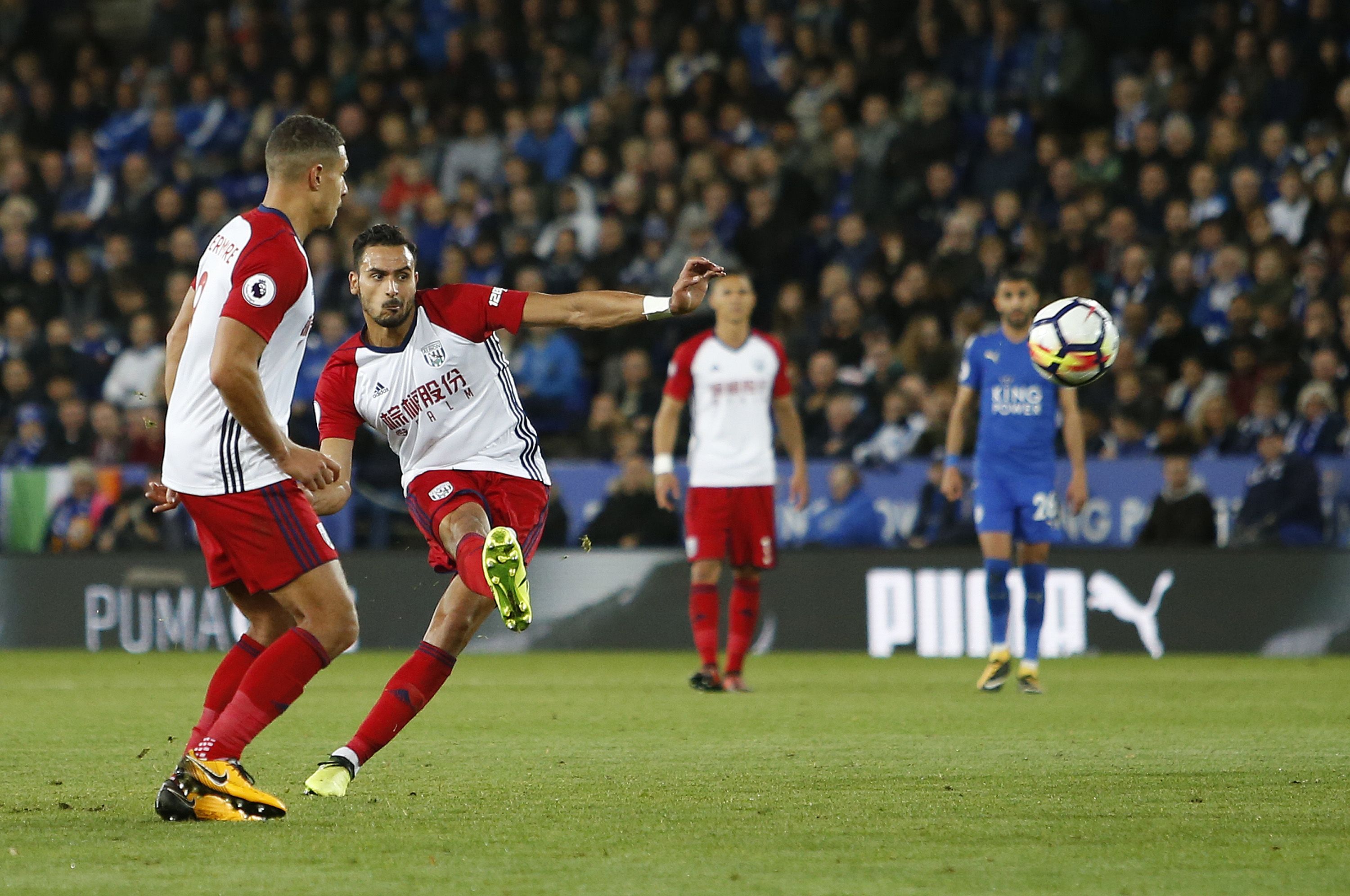 Nacer Chadli scores a free-kick against Leicester City at King Power Stadium in 2017