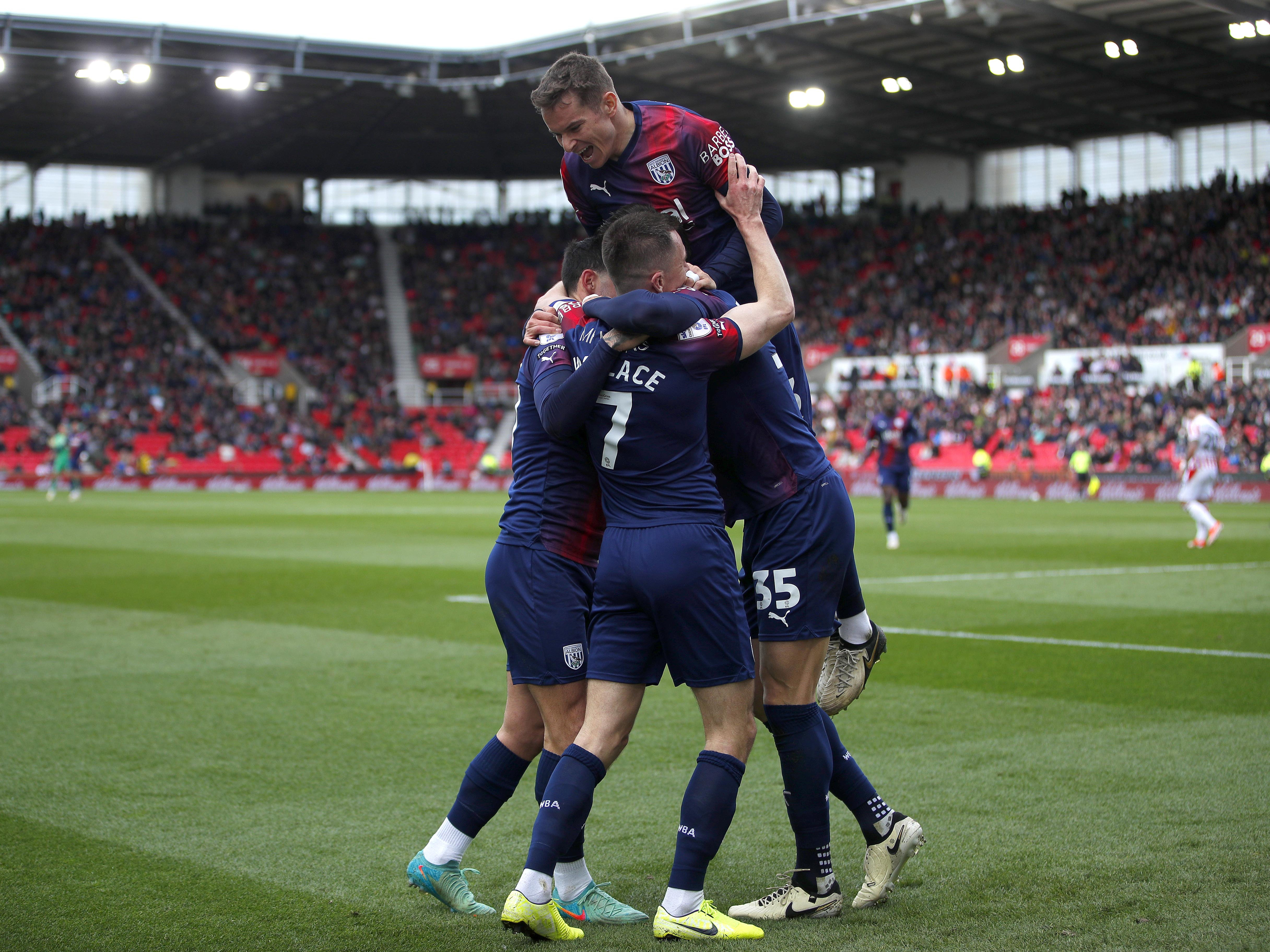 An image of Albion players celebrating Jed Wallace's goal at Stoke