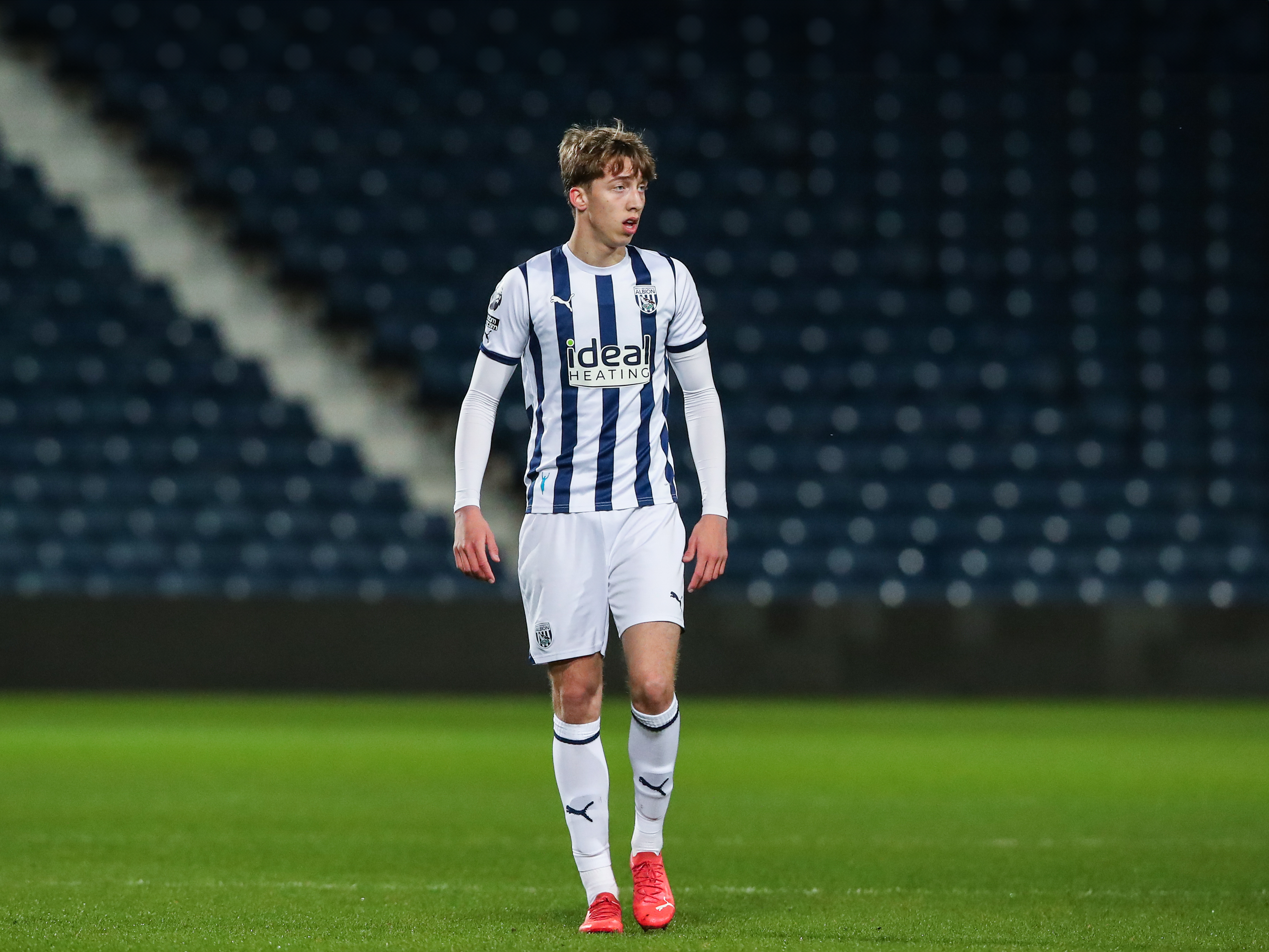 A photo of Albion youngster Harry Whitwell, in the 23/24 home kit, in action at The Hawthorns