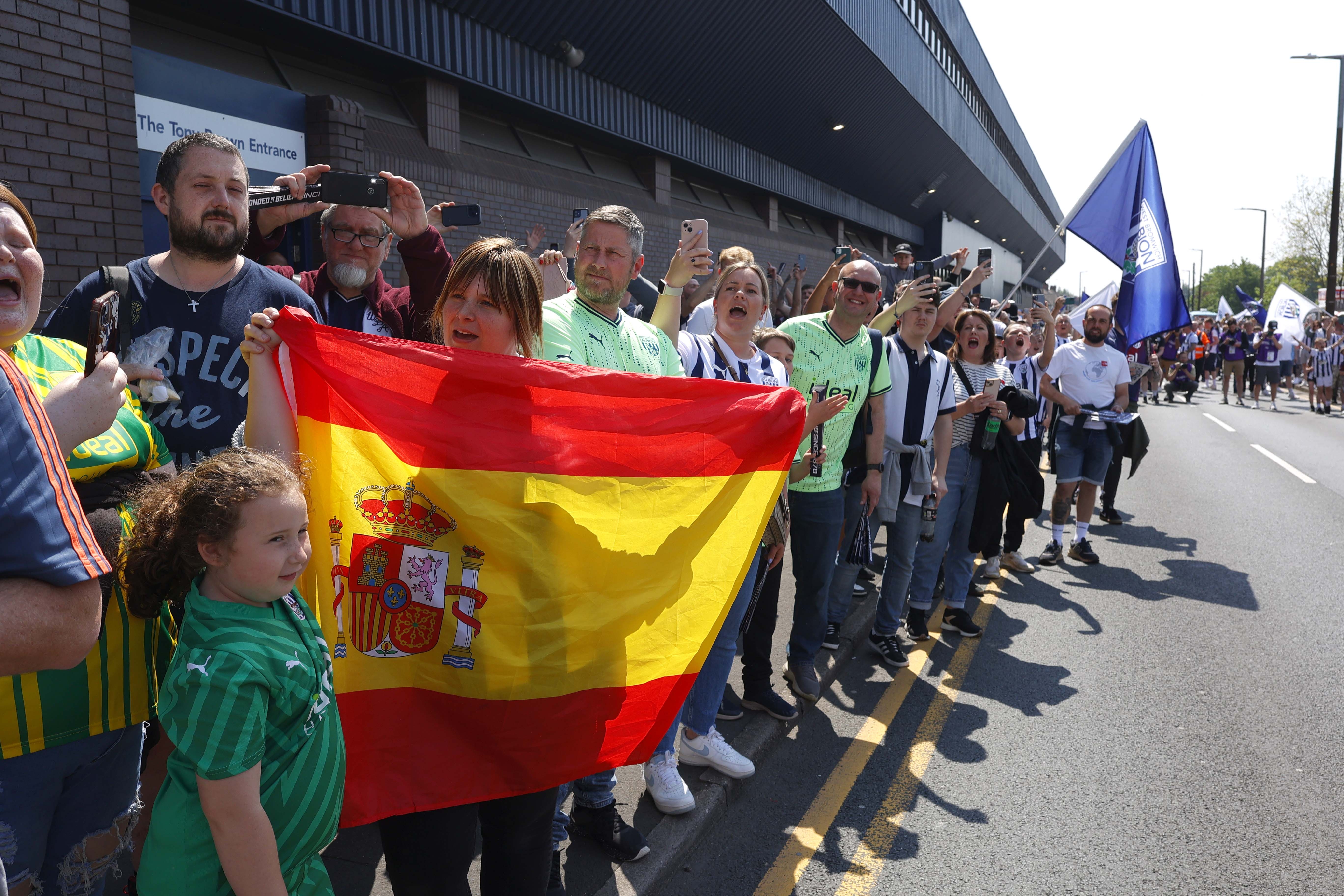 A general view of Albion supporters outside the stadium before the match against Southampton at The Hawthorns with one holding a Spain flag
