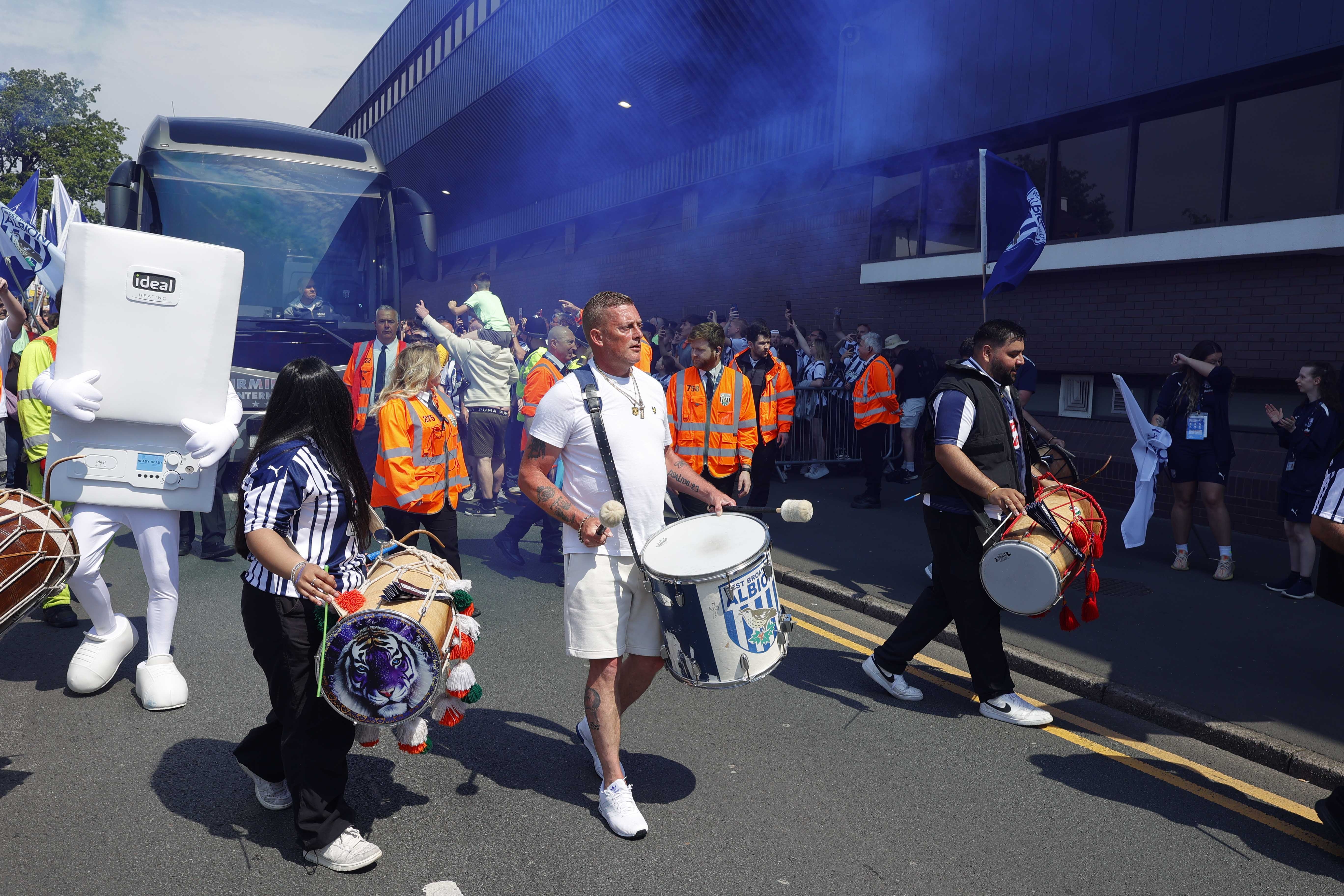 Drummers welcome the Albion team bus to The Hawthorns on Halfords Lane 