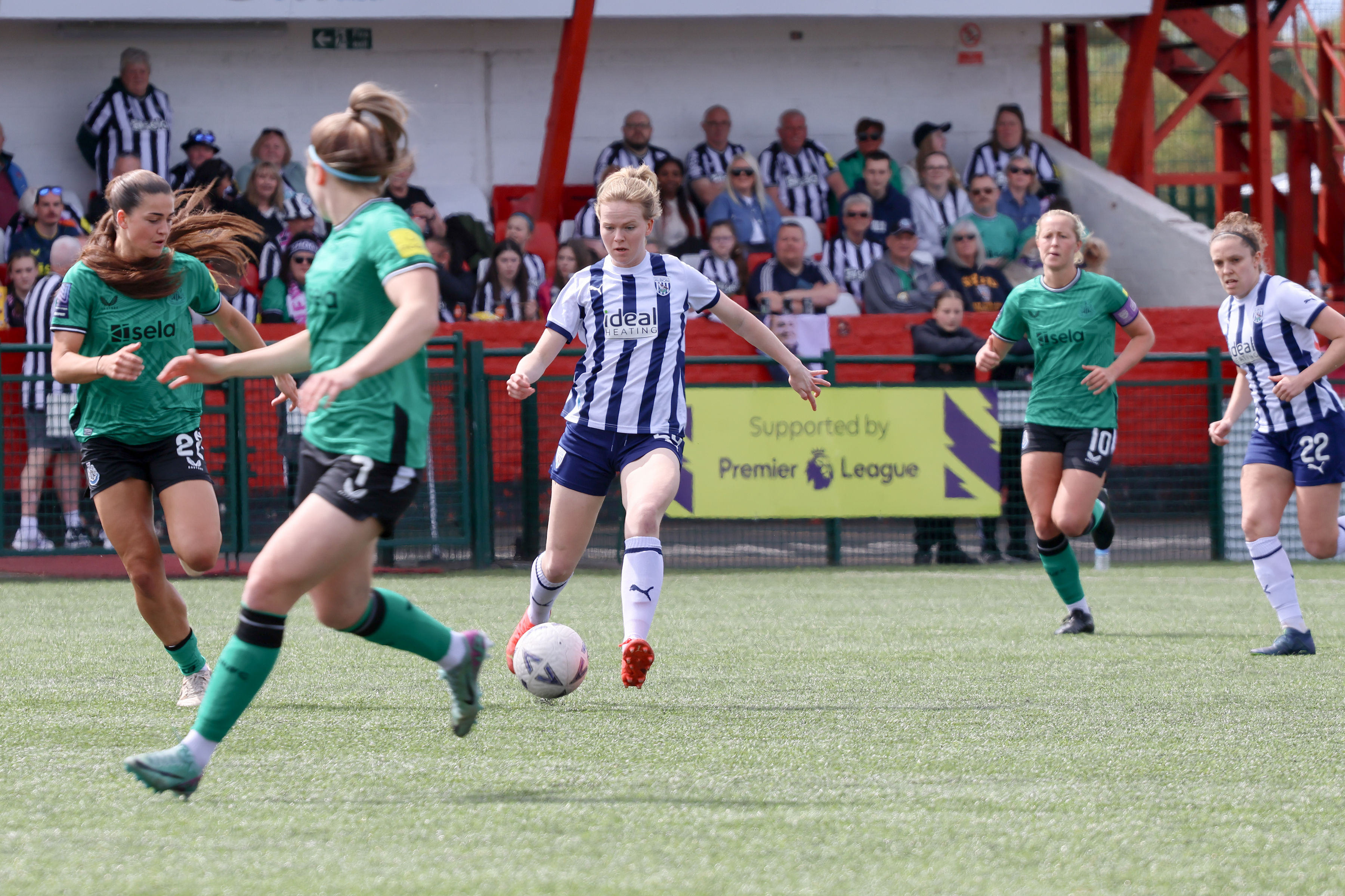 Pheobe Warner in action for Albion Women against Newcastle United wearing the home kit