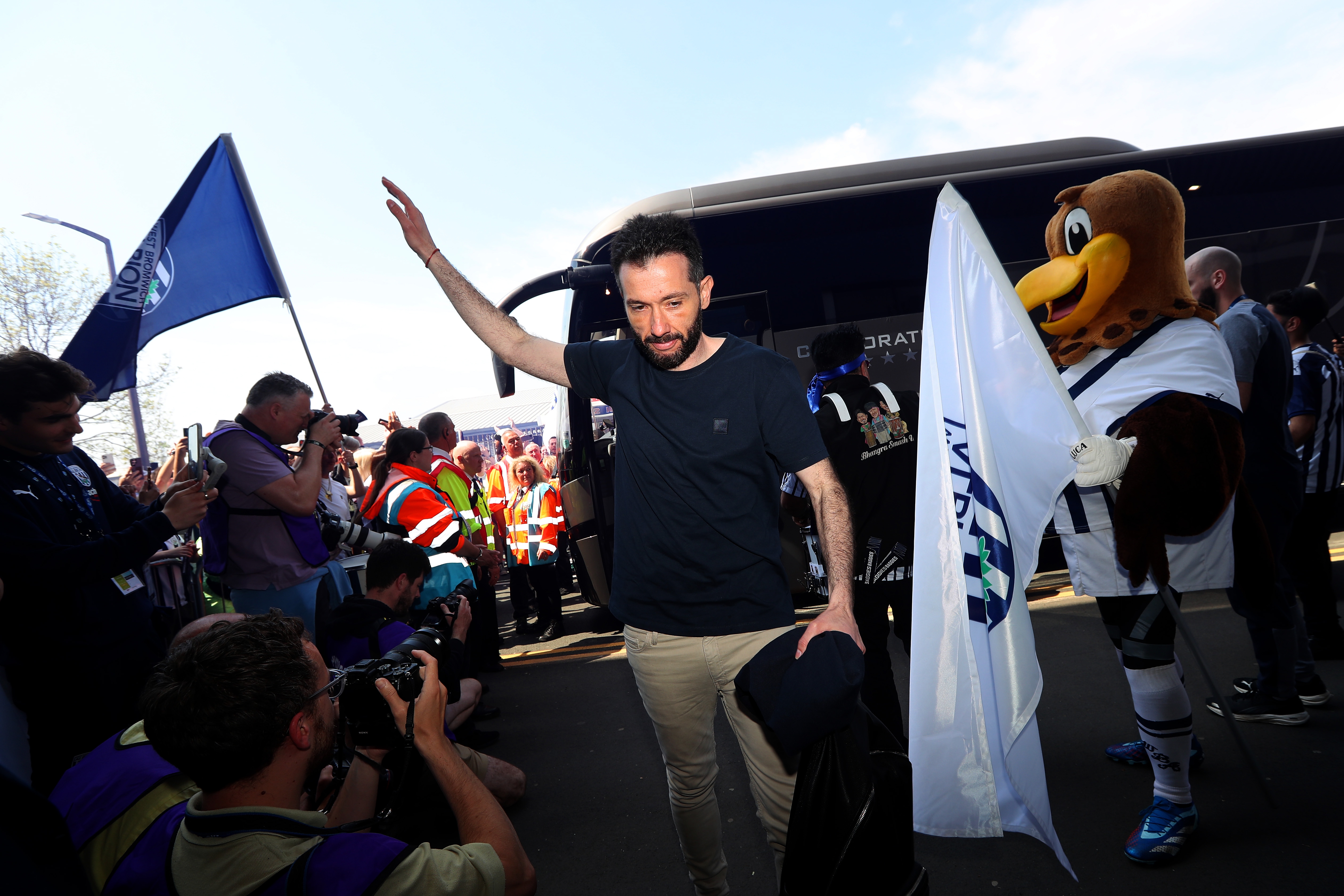 Carlos Corberán waving to supporters as he arrives at The Hawthorns before Albion's game with Southampton
