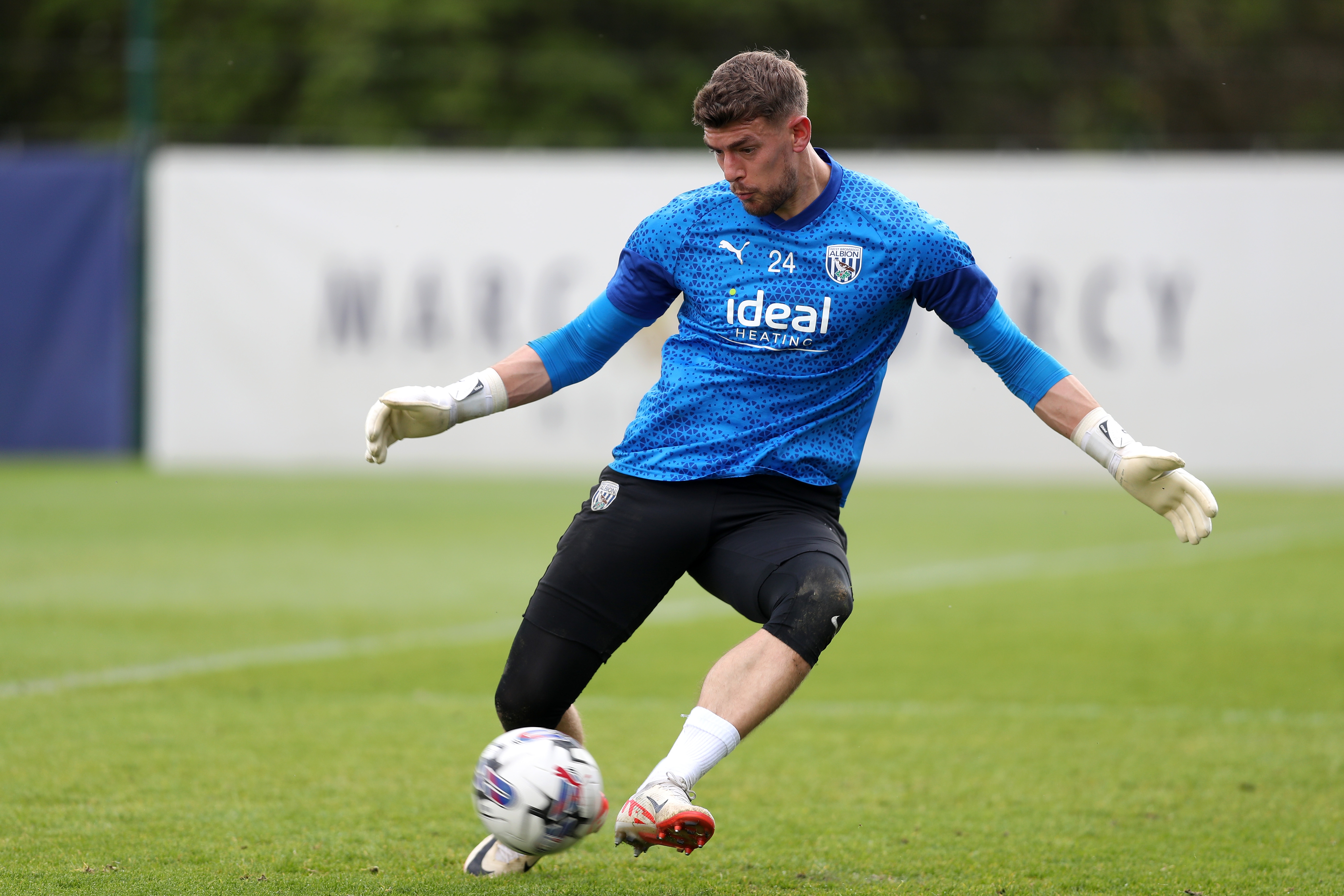 Alex Palmer making a save with his feet in training