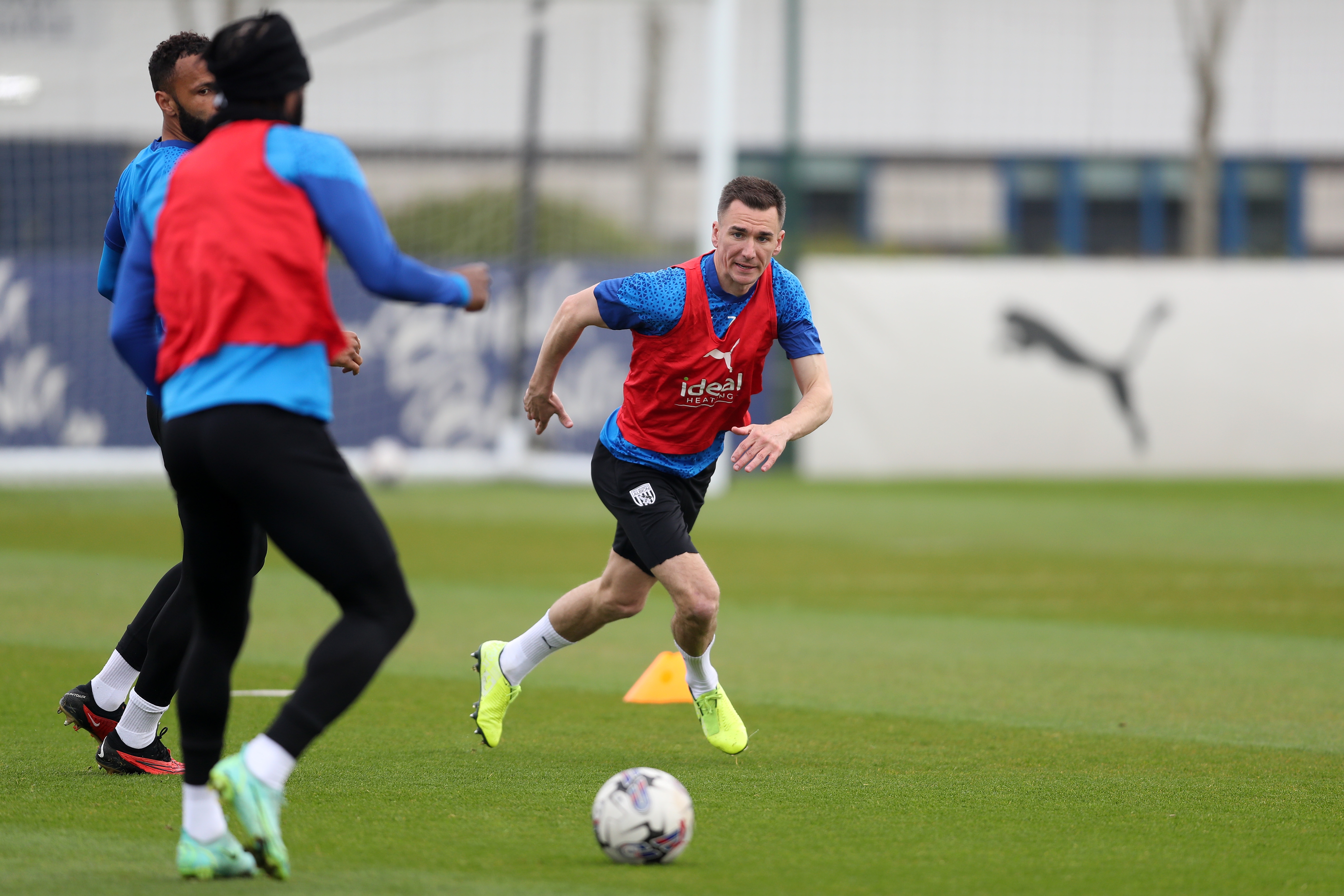 Jed Wallace chasing the ball during training 