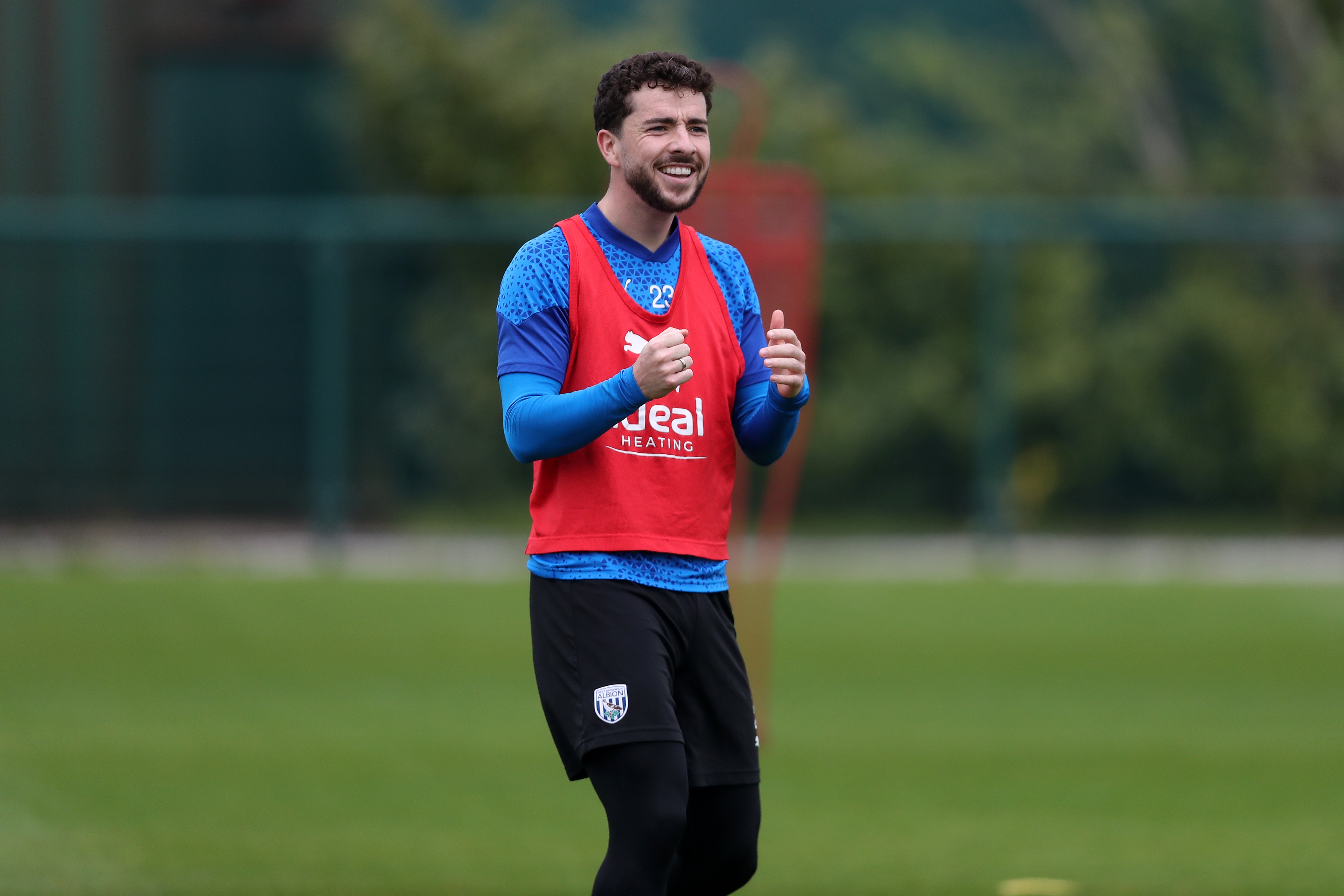 Mikey Johnston smiling during a training session